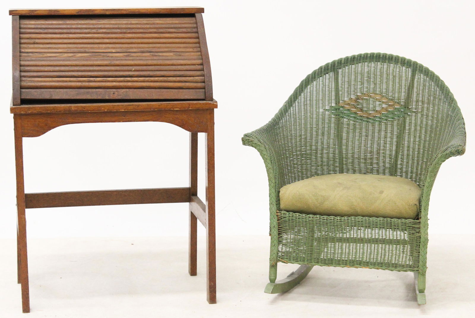 Child's Oak Roll Top Desk and Wicker Rocker: ca. 1920 Child's oak roll top desk in original finish (tambour needs repair) and Lloyd Loom type wicker rocker in original jade green paint 32" x 22" x 16", 26" x 24"