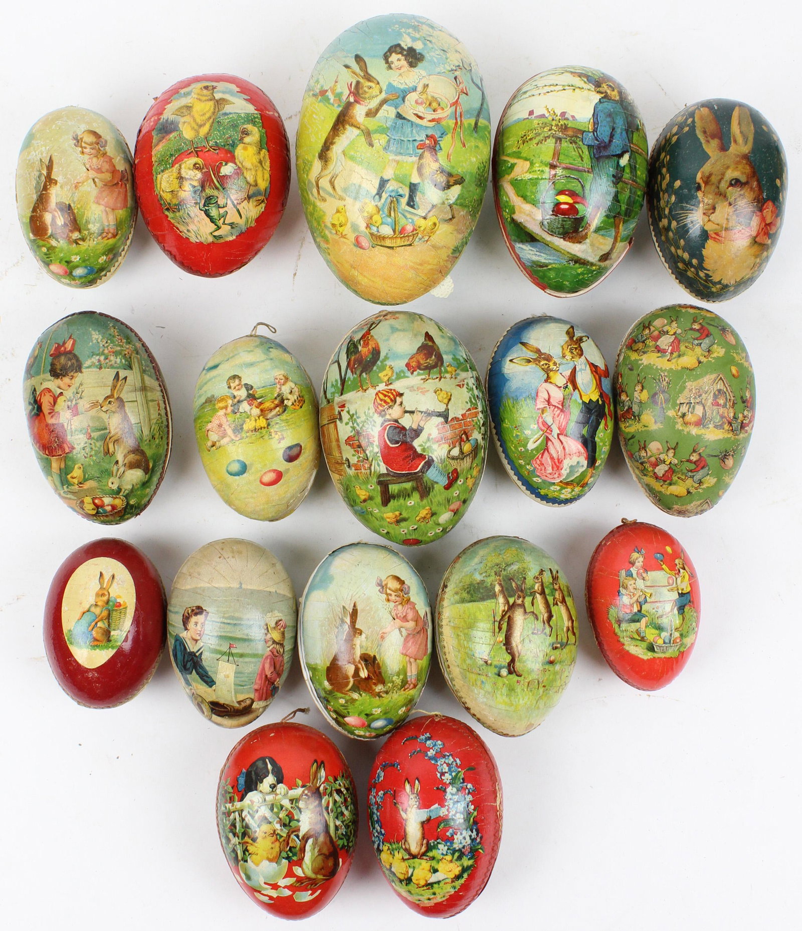 17 Easter Egg Candy Containers: 17 medium Easter Egg Candy Containers, color litho with Dresden trim, paper mache and boxboard, sizes 4" to 6 1/2"
