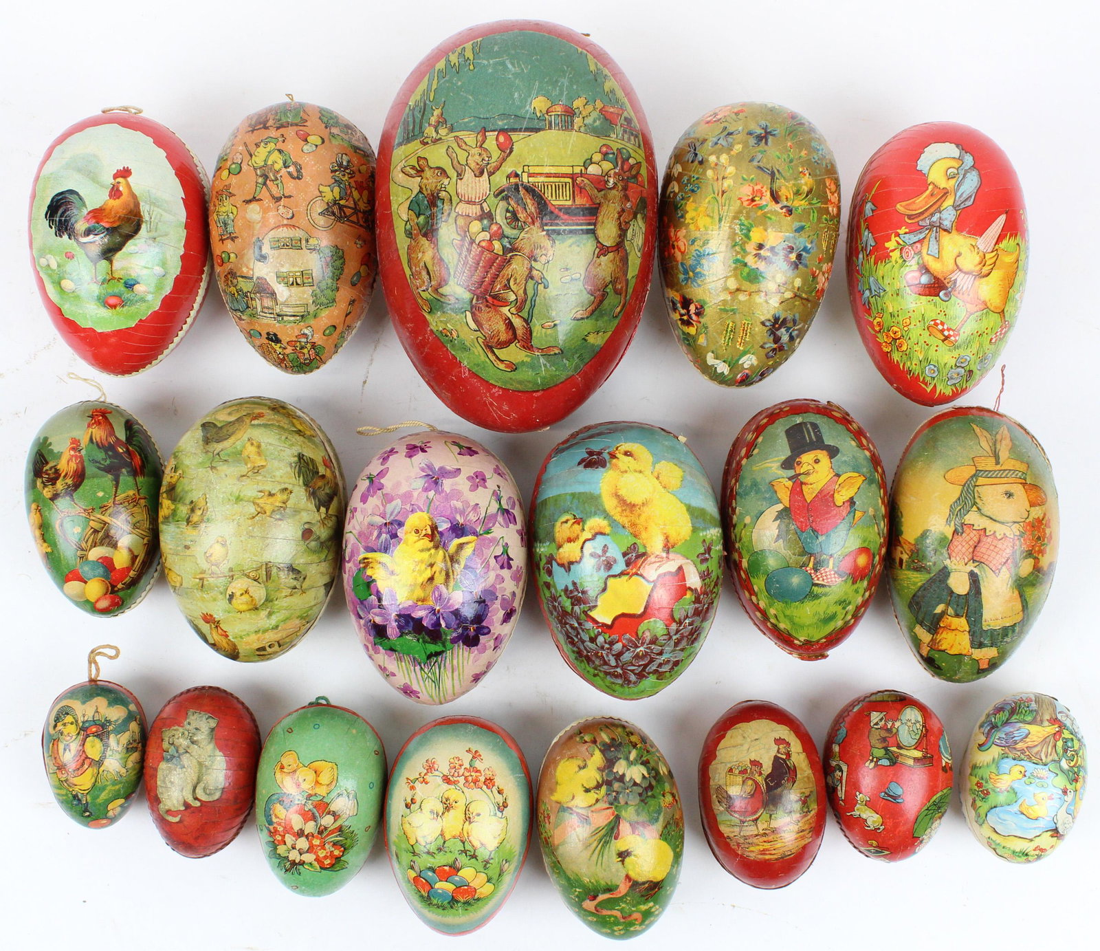 19 Easter Egg Candy Containers: 19 medium to large Easter Egg Candy Containers, color litho with Dresden trim, paper mache and boxboard, sizes 3" to 7 1/2"