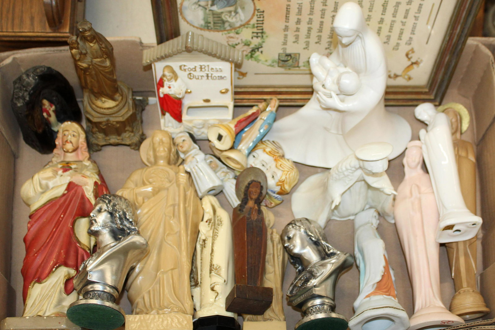 Lot of Religious Statuary: Lot of Catholic Religious Icons , Bible stand, books on Ecclesiastical subjects.