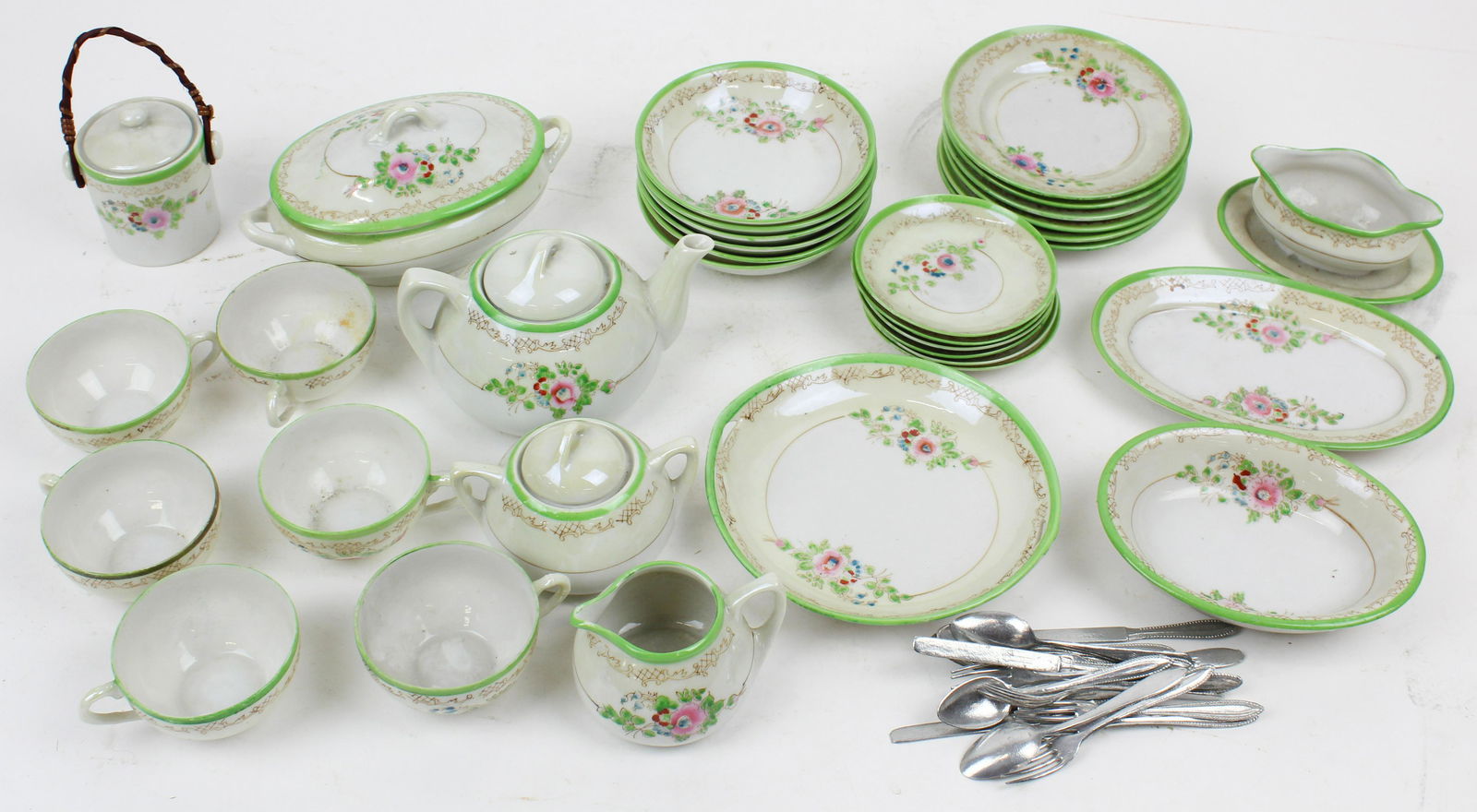 Japan Doll's Tea and Dinnerware Set: Early 20th c Japan doll or child's tea and dinnerware set ( 34 pcs), service for 6, including covered vegetable, gravy boat, teapot, creamer & sugar, 6 cups & saucers, covered vegetable is 6 1/2" long