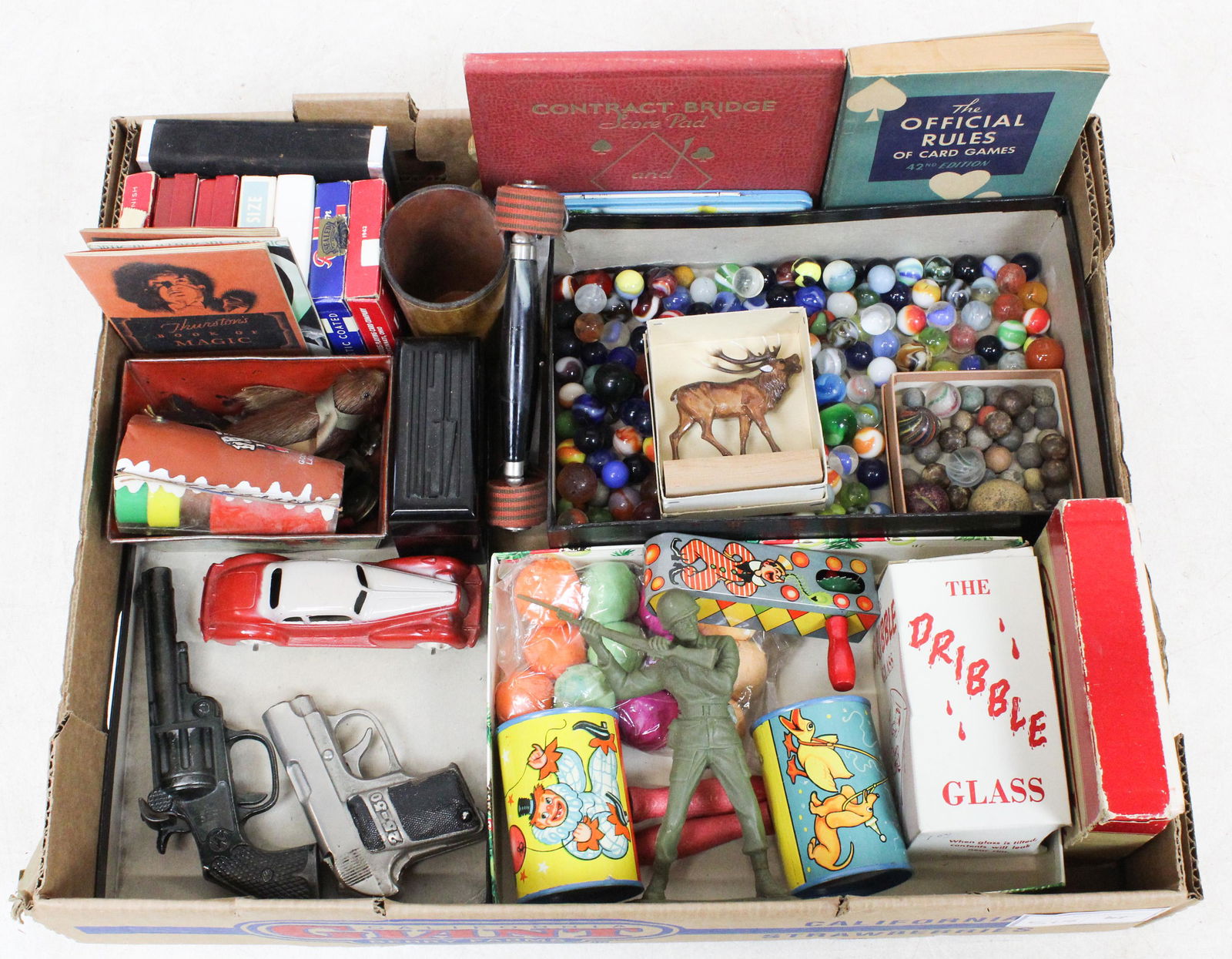 Lot of Vintage Tin Litho Toys, Marbles, Etc.: Lot of vintage toys including tin litho rattles and noisemakers, Hubley Kiddie toy car in like new condition, cast iron cap guns, decks of cards, marbles including clays, agates, swirls, etc.