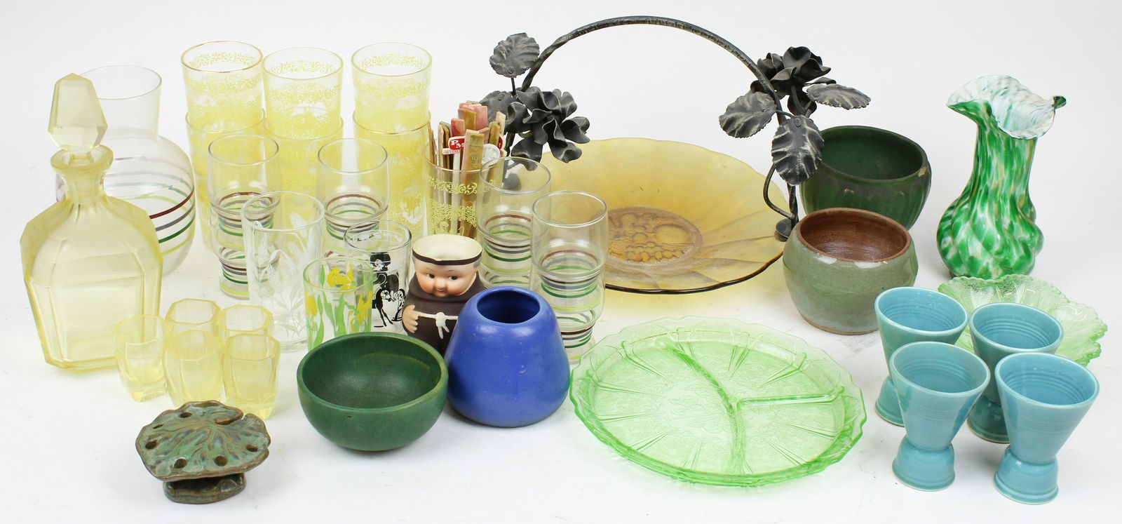 Lot of Various Art Glass and Pottery: Lot of various art glass and pottery including 6 pc. Yellow cut glass decanter cordial set, 5 pcs. 1920's art pottery (one with chip to rim), cased green mottled glass vase, 1950's barware tumblers, e