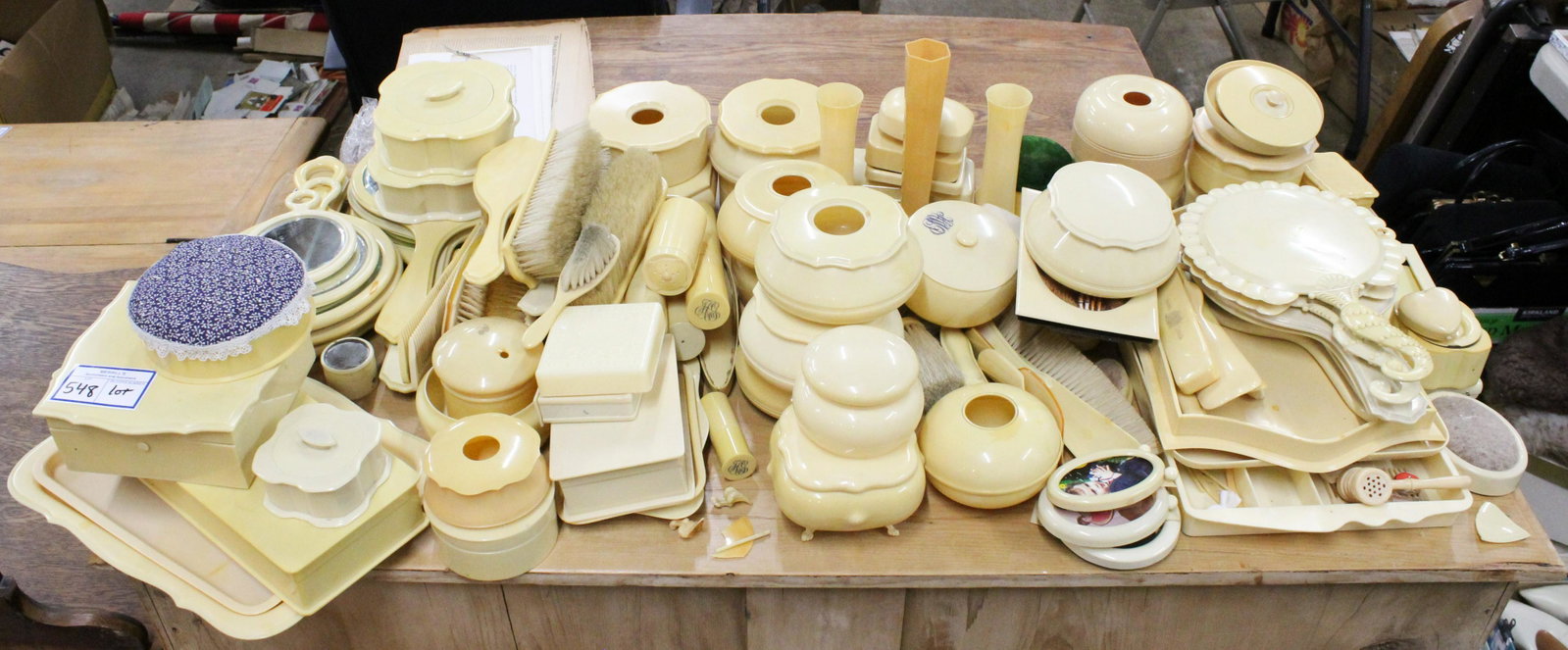 Collection of "French Ivory" Celluloid Accessories: Large collection of "French Ivory" celluloid dresser items and accessories including hand mirrors, brushes, hair receivers, powder jars, toiletry cases, straight razors, portrait frames, jewelry boxes