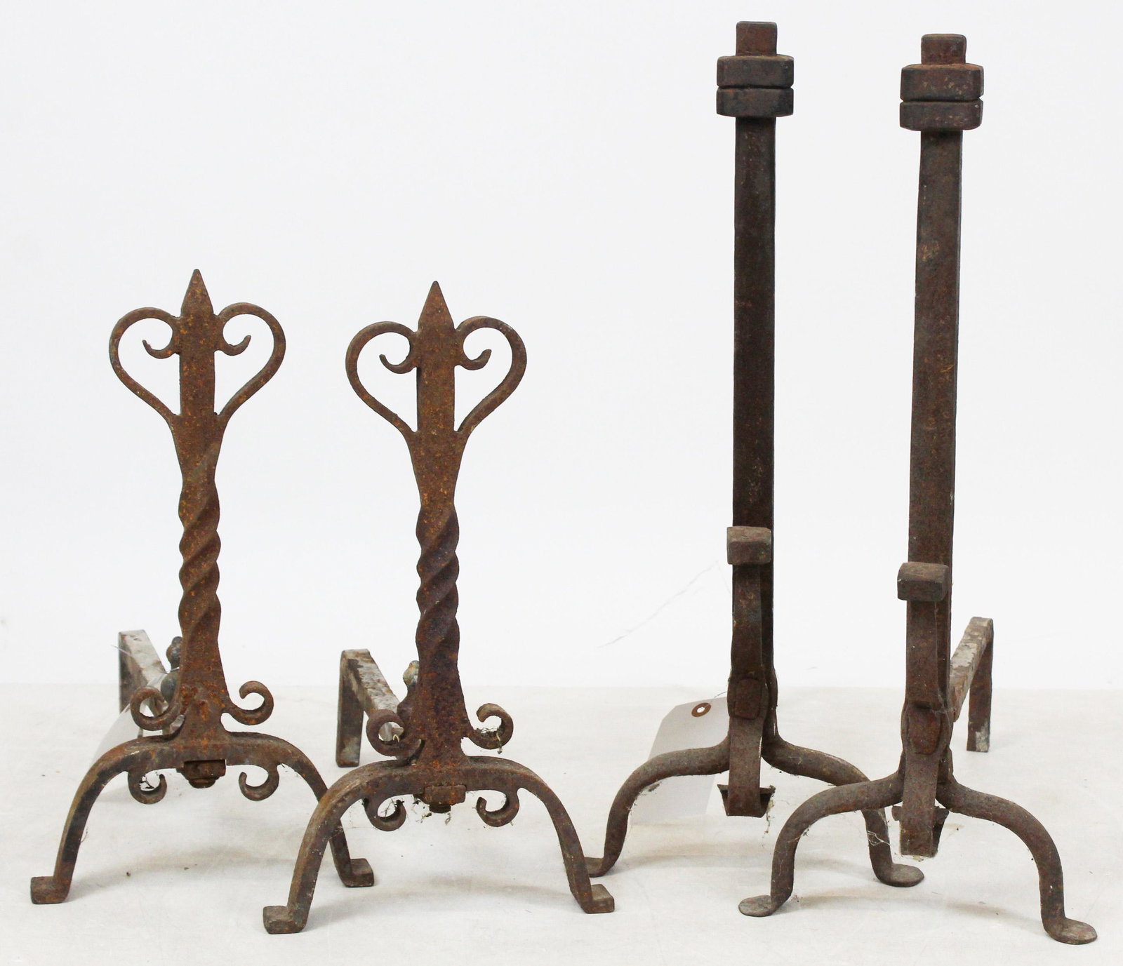 Two Pairs of Wrought Iron Andirons: Two pairs of Arts & Crafts era wrought iron andirons, hts 18", 25"
