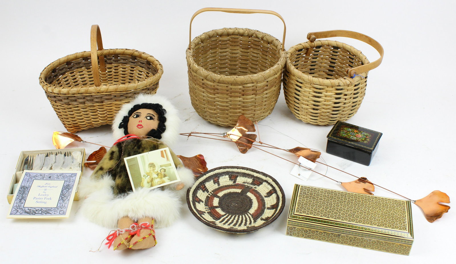 Decorative Accessories incl. Baskets, Mobile, etc.: Lot of assorted decorative accessories including 2 Thomas Conway Orr's Island, ME baskets, coil basket, inlaid and Russian lacquer boxes, Alaskan seal skin doll, copper gingko leaf mobile kinetic scul