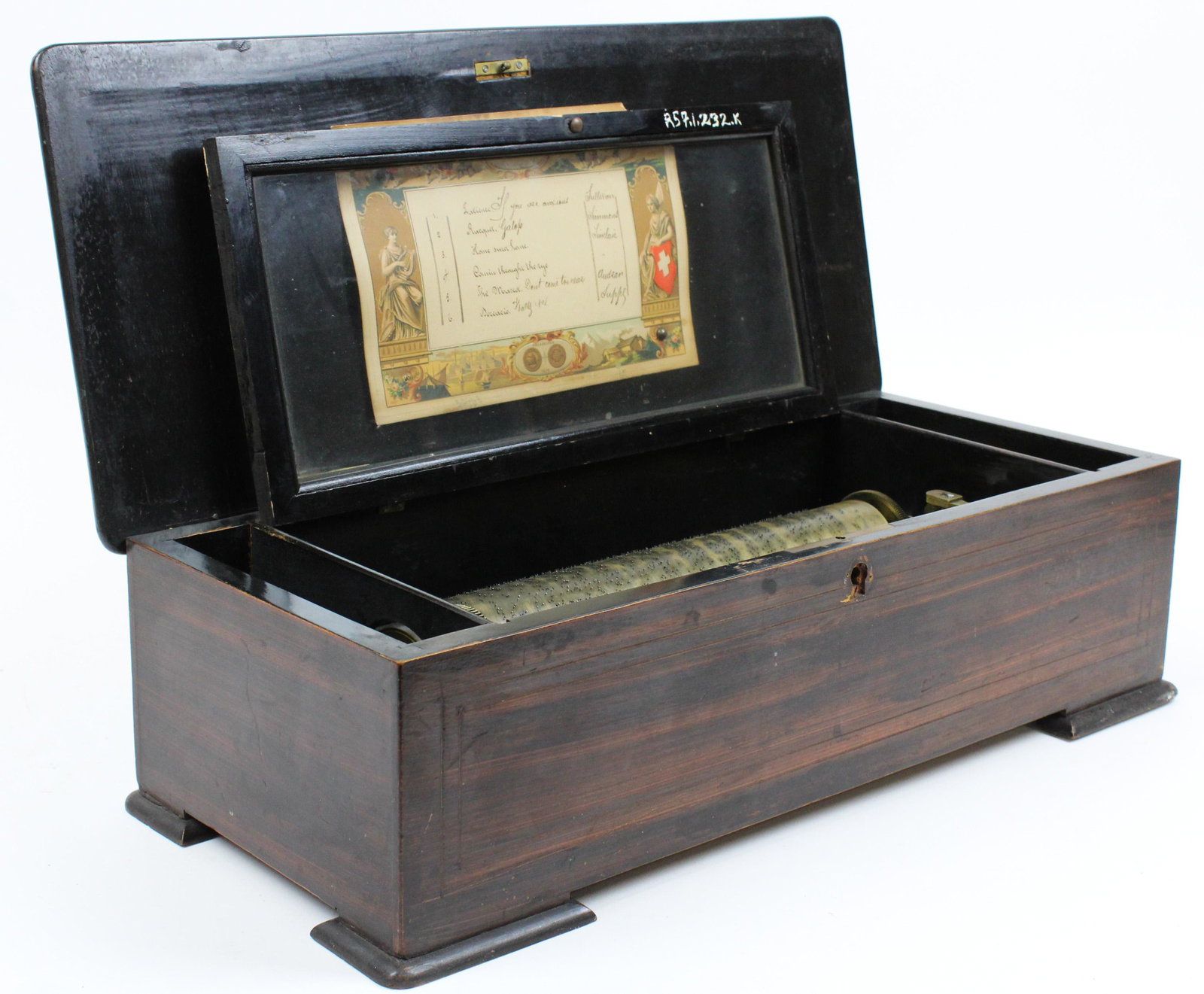 19th c Swiss Rosewood Case Music Box: 19th c Swiss music box, 10 3/4" comb, one tooth broken, not working, case 19 1/2" x 8 1/4" x 6 1/4", sold to benefit the Vermont Historical Society