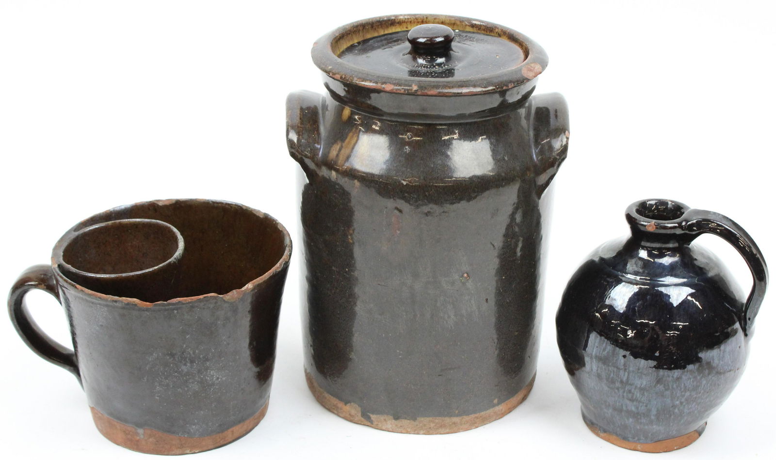 Early 19th c Redware Crock, Jug, Shaving Mug: Early 19th c Albany slip glazed redware including a crock with lid, small ovoid jug, and a shaving mug with soap holder (see Richard carter Barrett "Bennington Pottery and Porcelain page 103 Plate 141