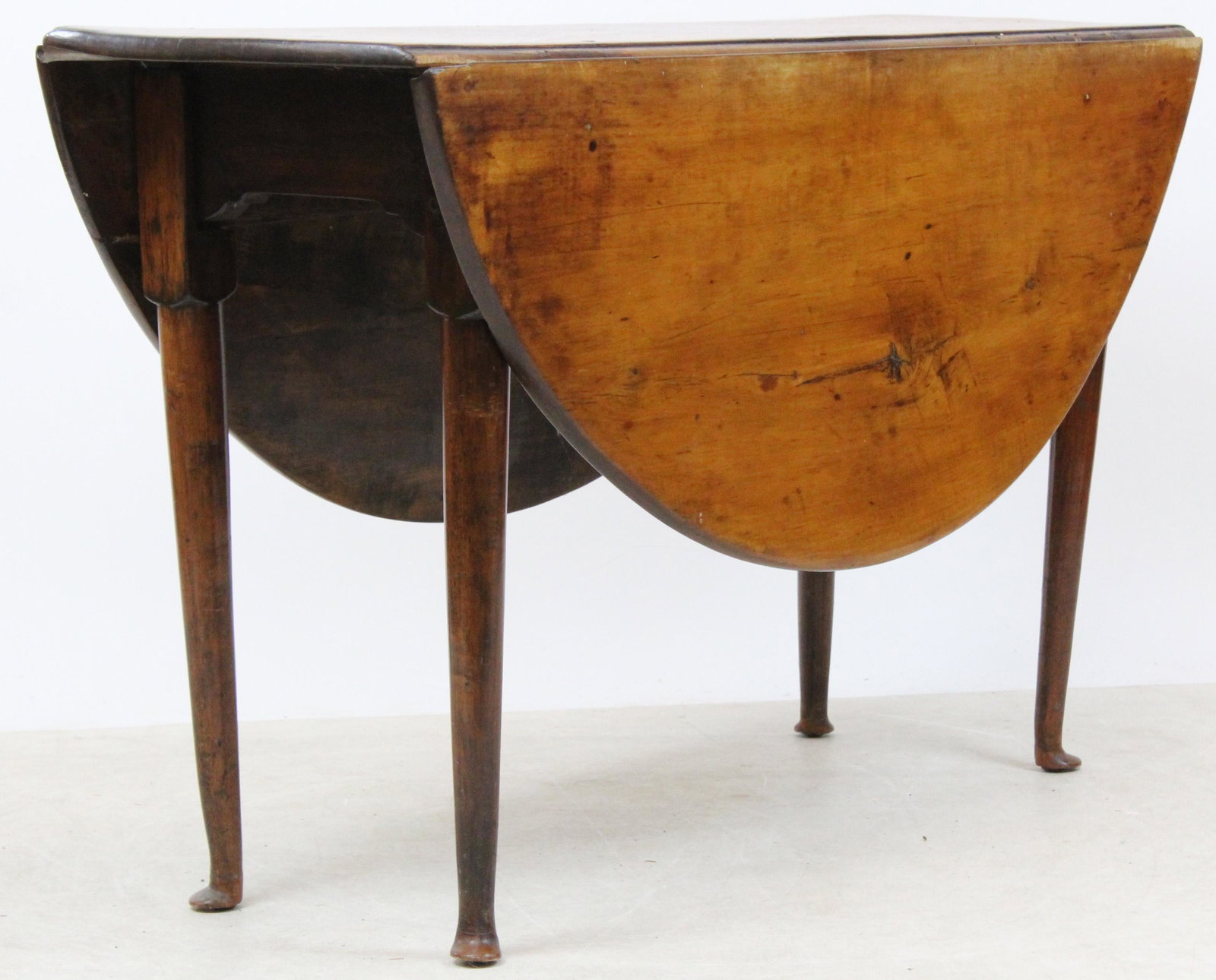 New England Queen Anne Tiger Maple Drop leaf Table: 18th c New England Queen Anne tiger maple drop leaf table. Primitive oval table with ended out pad feet. 45" long. 26" h, 14" w, 46" wide with top up.