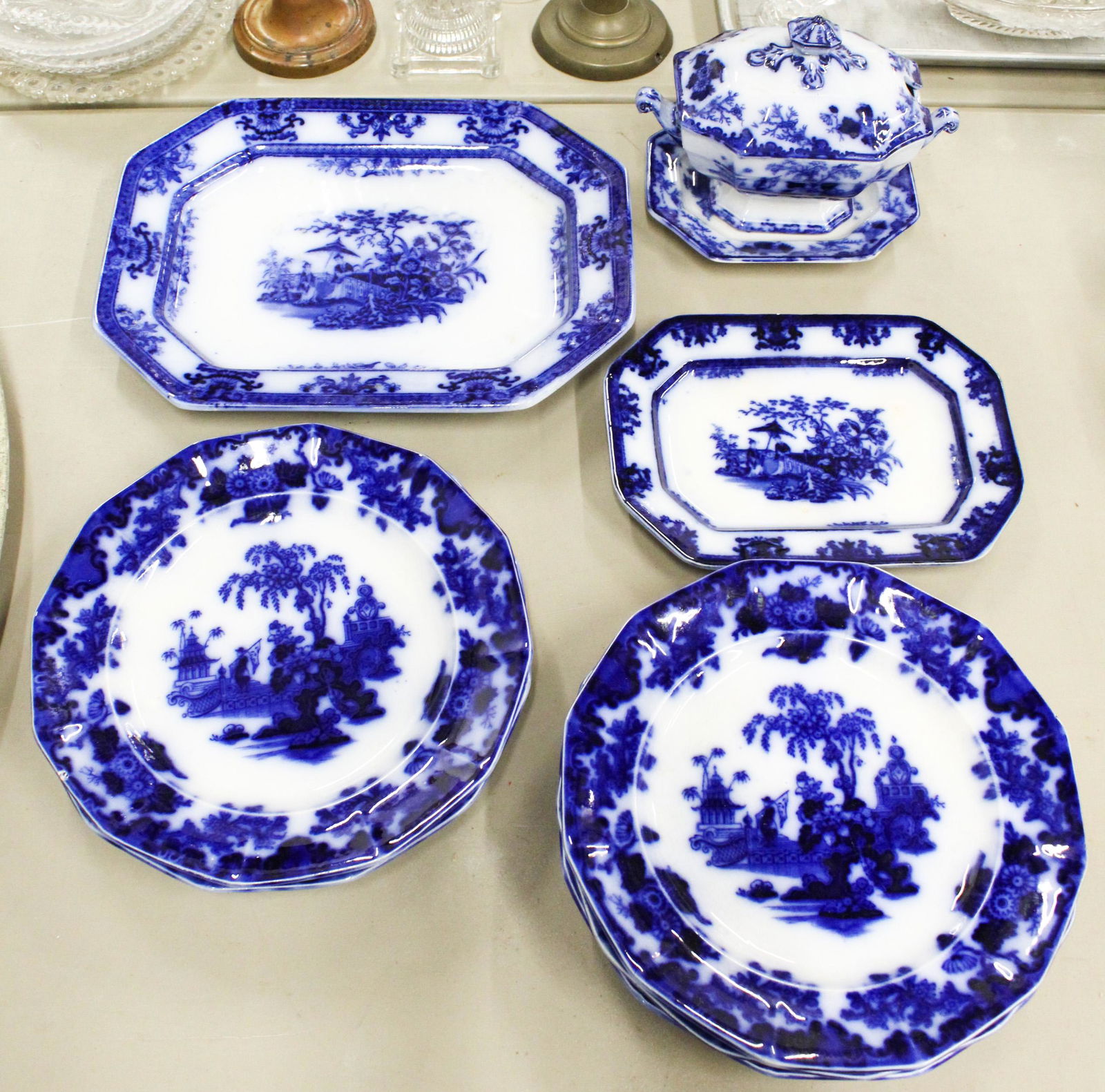 9 pcs. 19th c. Flow Blue Ironstone Dinnerware: Group of 9 pcs. 19th c. Flow Blue cobalt transfer decorated ironstone tableware including set of 6 "Scinde" pattern dinner plates, 2 Davenport serving platters and covered sauce tureen with underplate