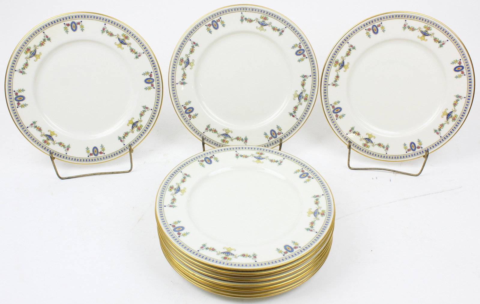 Set of 12 Lenox The Colonial Dinner Plates: Set of 12 Lenox "The Colonial" pattern bone china porcelain dinner plates with neoclassical urn, festoon and spandrel decoration, having raised enamel accents, in excellent condition dia. 10.25"