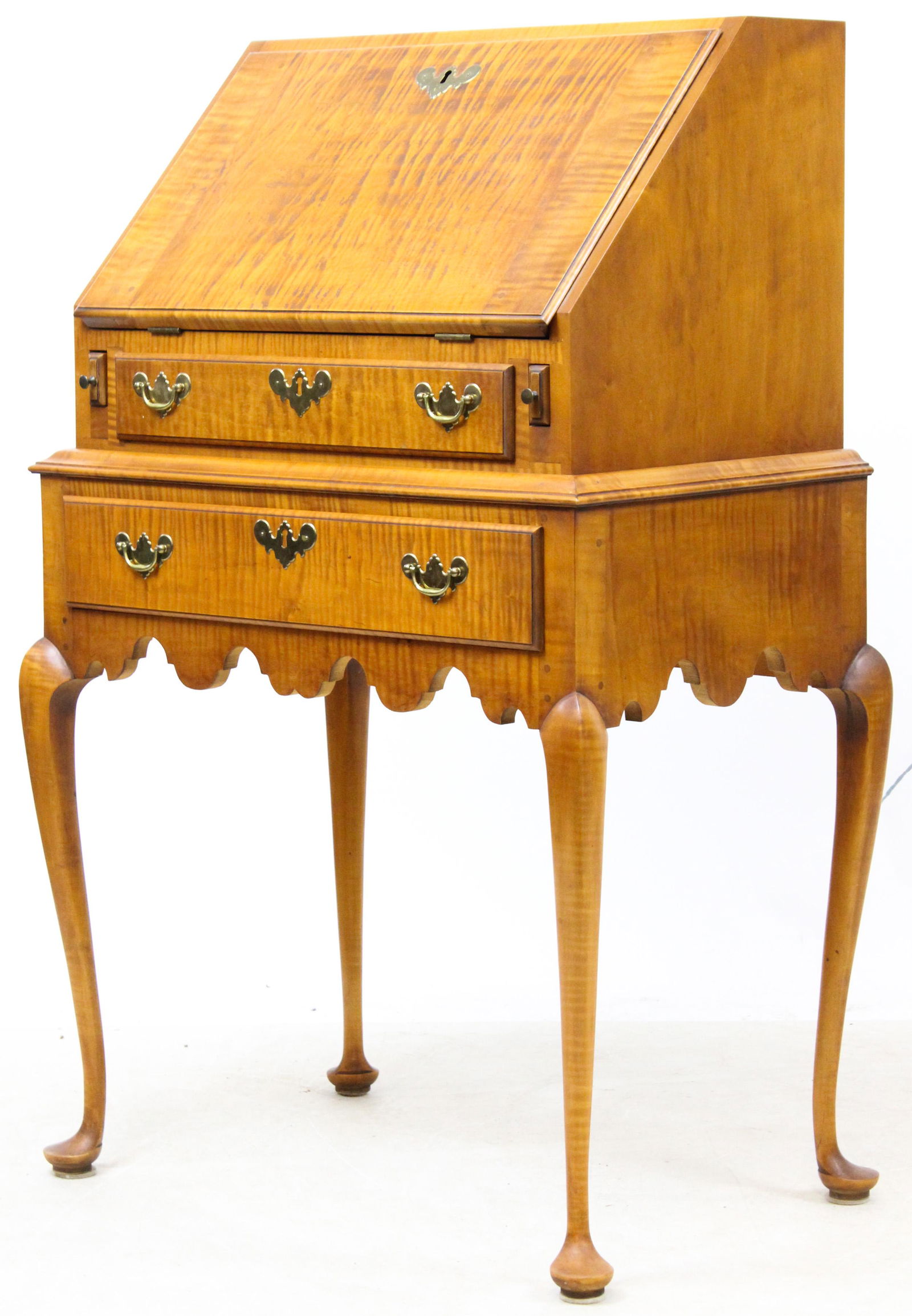 Eldred Wheeler Tiger Maple Desk on Stand: Eldred Wheeler Queen Anne Style Desk on Frame. Petite slant front desk, fitted shell carved stepped interior, two drawers, shaped skirt, cabriole leg with pad foot. Original label. 22 1/2" wide. 40" h