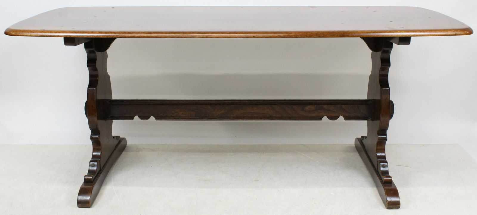 Ercol Chestnut Trestle table: 20th c Chestnut trestle table made by Ercol Furniture Co. England. 6' long, 29" w, 28" h.