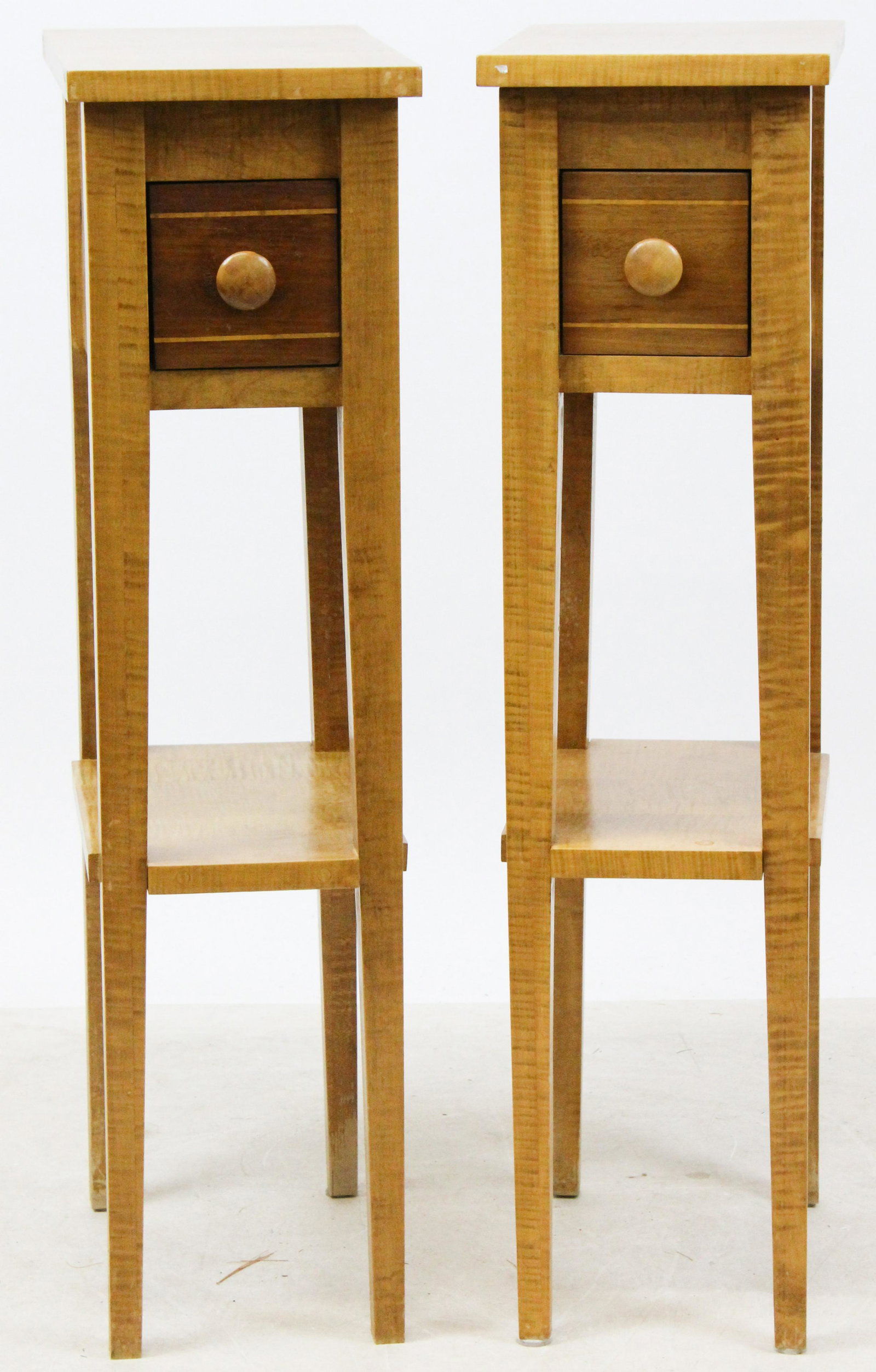 Pair Tiger Maple Bedside Stands: Pair of petite custom tiger maple single drawer bedside stands with lower shelves. Drawer fronts out of walnut with string inlay. 35" h, 9" w, 14" deep.