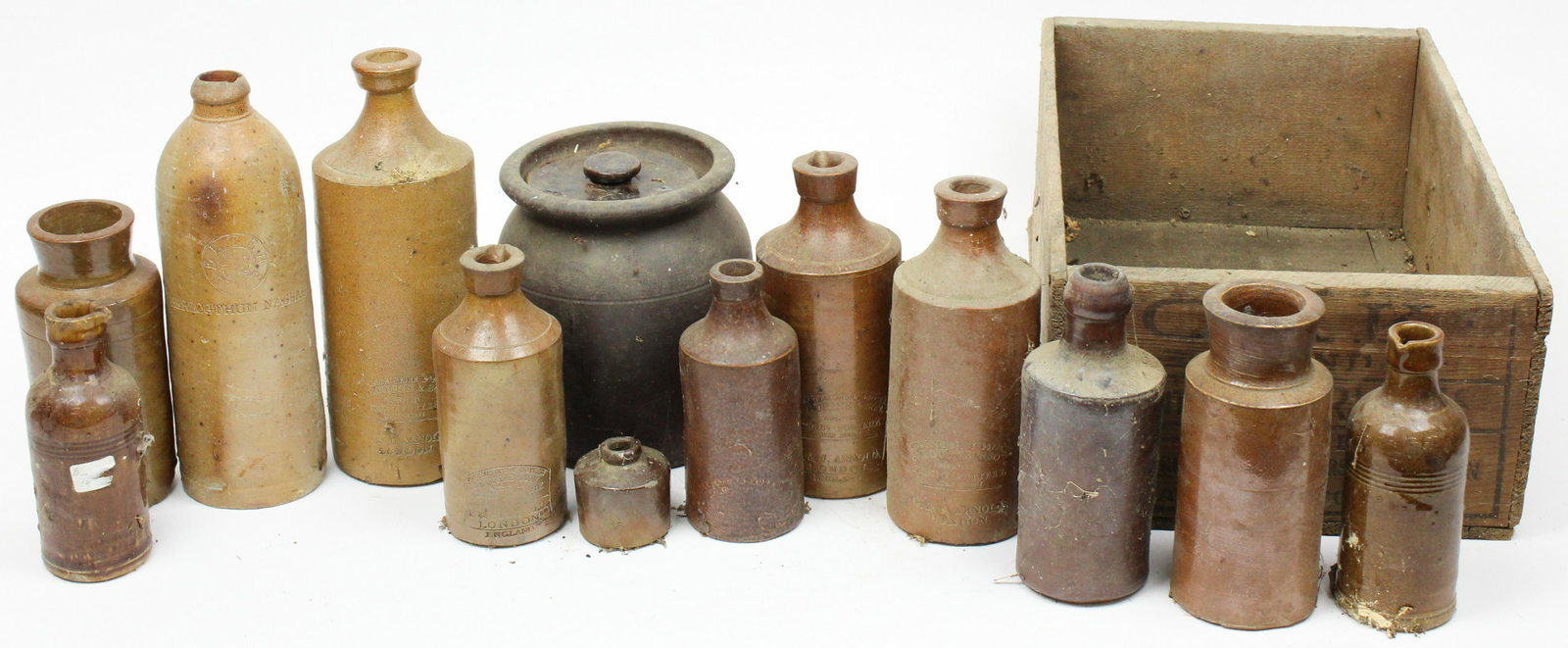 Ca 1900 Stoneware Bottles: Ca 1900 stoneware bottles, including inks, blacking, beer (12 pcs), hts 2" to 9", sold with a crock with lid