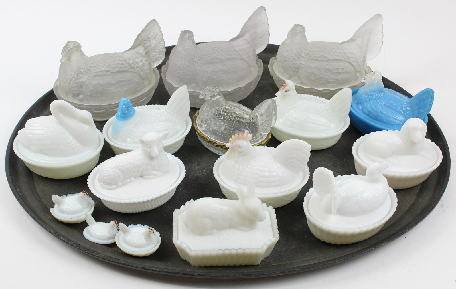 Collection of Pattern Glass Hens on Nests: Collection of 15 late 19th c. pattern glass hens on nests and other novelty covered dishes including rabbit, turkey, lamb, dog, swan and rooster, some in frosted and milk glass, some Westmoreland and 
