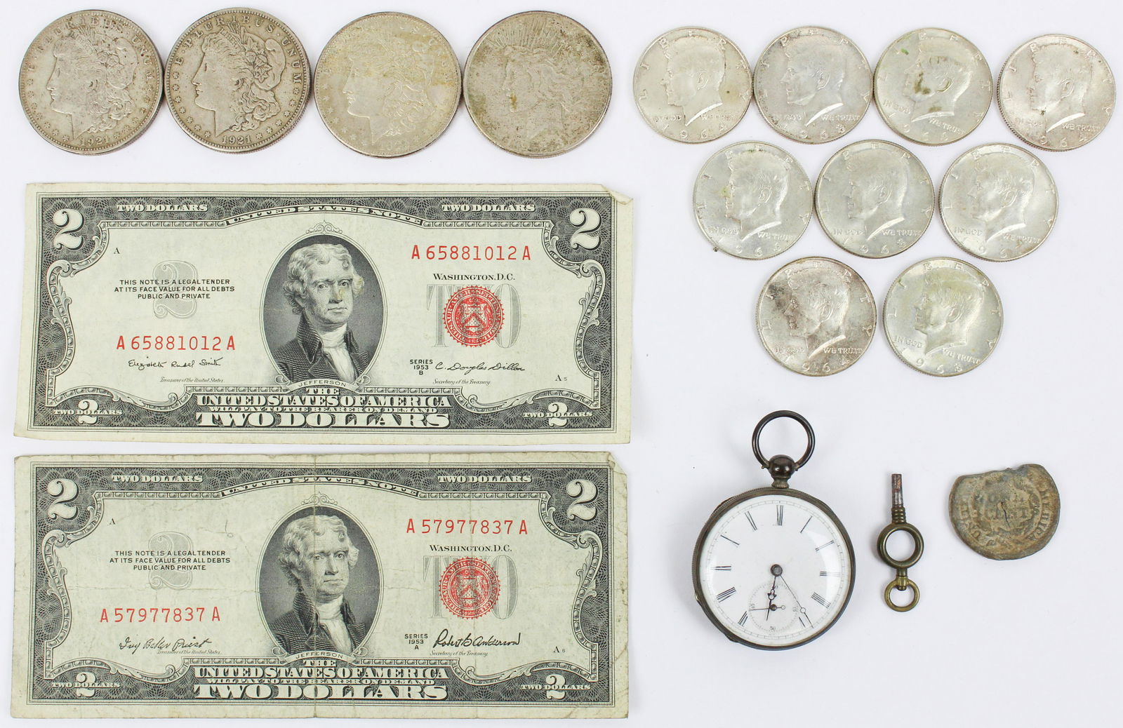 US Coins, Currency, English Key Wind Watch: US coins, currency,including four US silver dollars, three 1964 Kennedy half dollars, and six Kennedy 40% silver half dollars, English silver key wind watch (not running), two $2 dollar bills