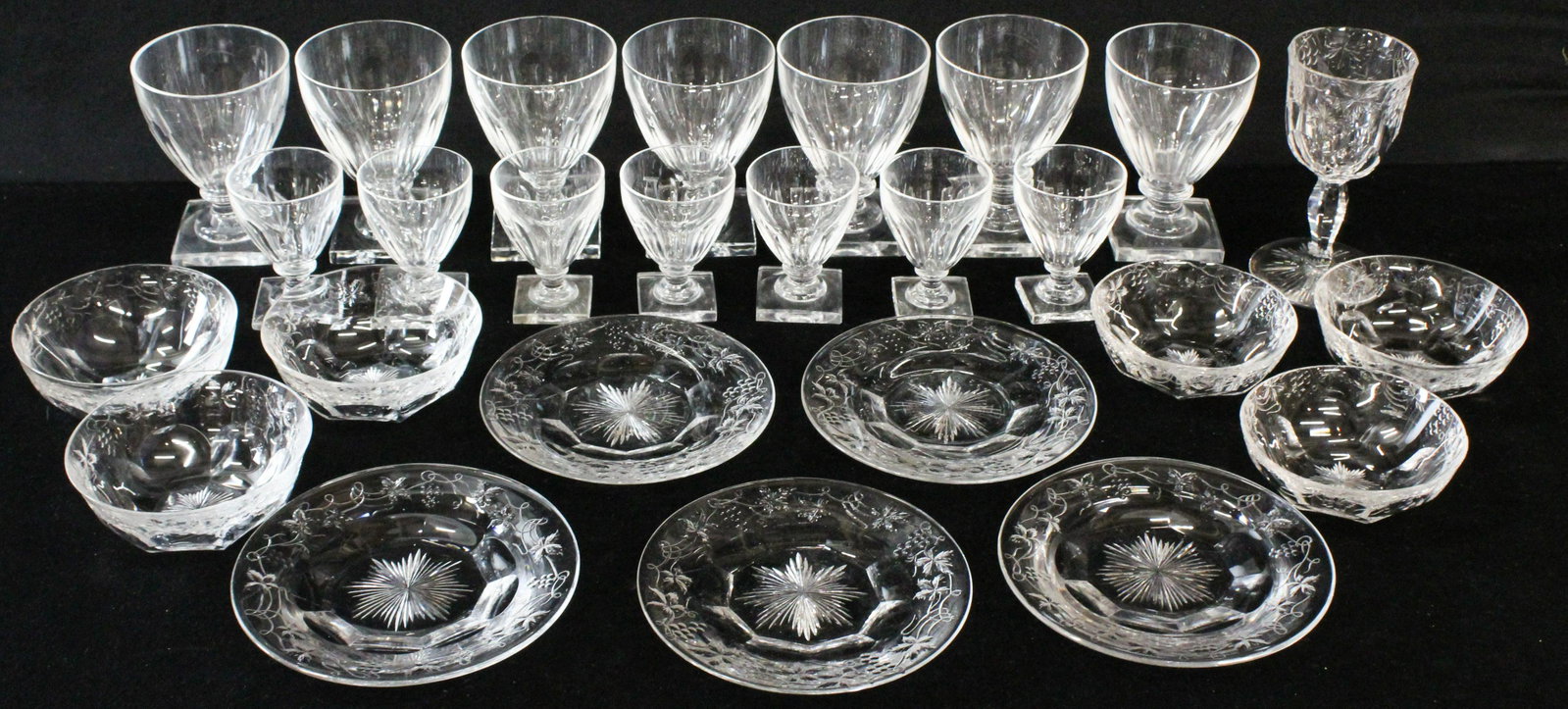 14 Anglo Irish Cut Glass Footed Goblets: Set of 14 19th c. Anglo Irish cut glass paneled goblets on squared stems with polished pontils, in cordial and water sizes, accompanied by a group of 12 pcs. brilliant wheel cut table ware (as found, 