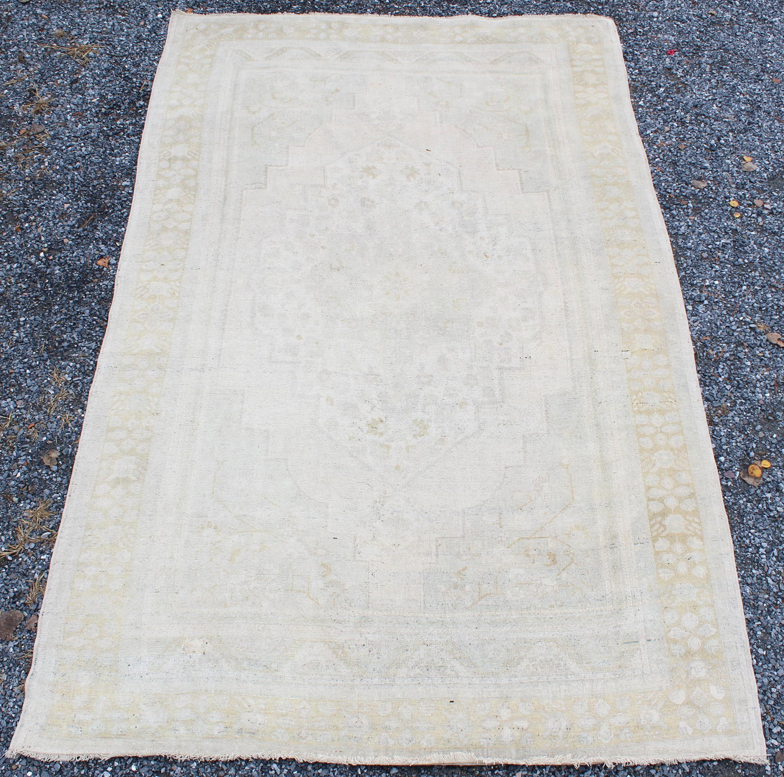 Turkish Room Size Oriental Carpet: Early 20th c Turkish room size Oriental carpet, sun faded design, small patch repair, 7' 3" x 12'