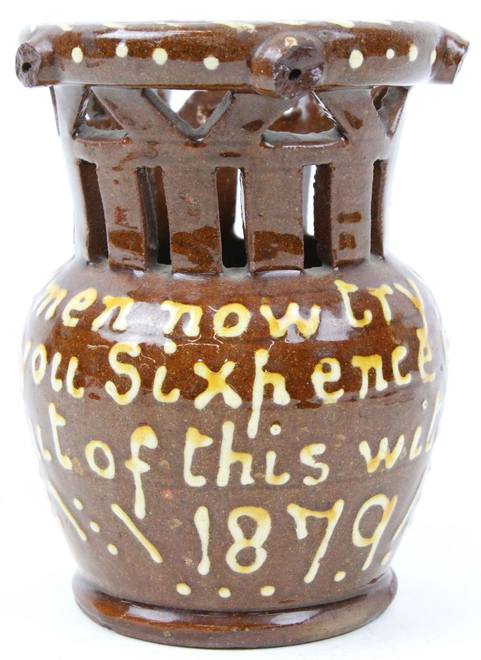 1879 English Redware Puzzle Mug: 1879 English redware pottery reticulated puzzle mug inscribed with slip decoration "Gentlemen now try your skill. I'll lay you sixpence if you will. Drink out of this without a spill 1879" 6.5" x 7"