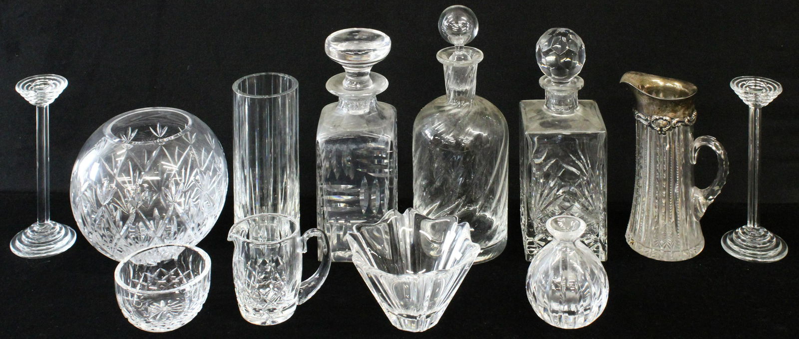 Lead Crystal Tableware Incl. Baccarat, Waterford: Group of 12 pcs. lead crystal cut glass including Bacarrat cylindrical vase, Tiffany & Co. decanters, Rogaska decanter, pair of Riedel for Tiffany & Co., Orrefors bowl, Waterford sugar and creamer, ro