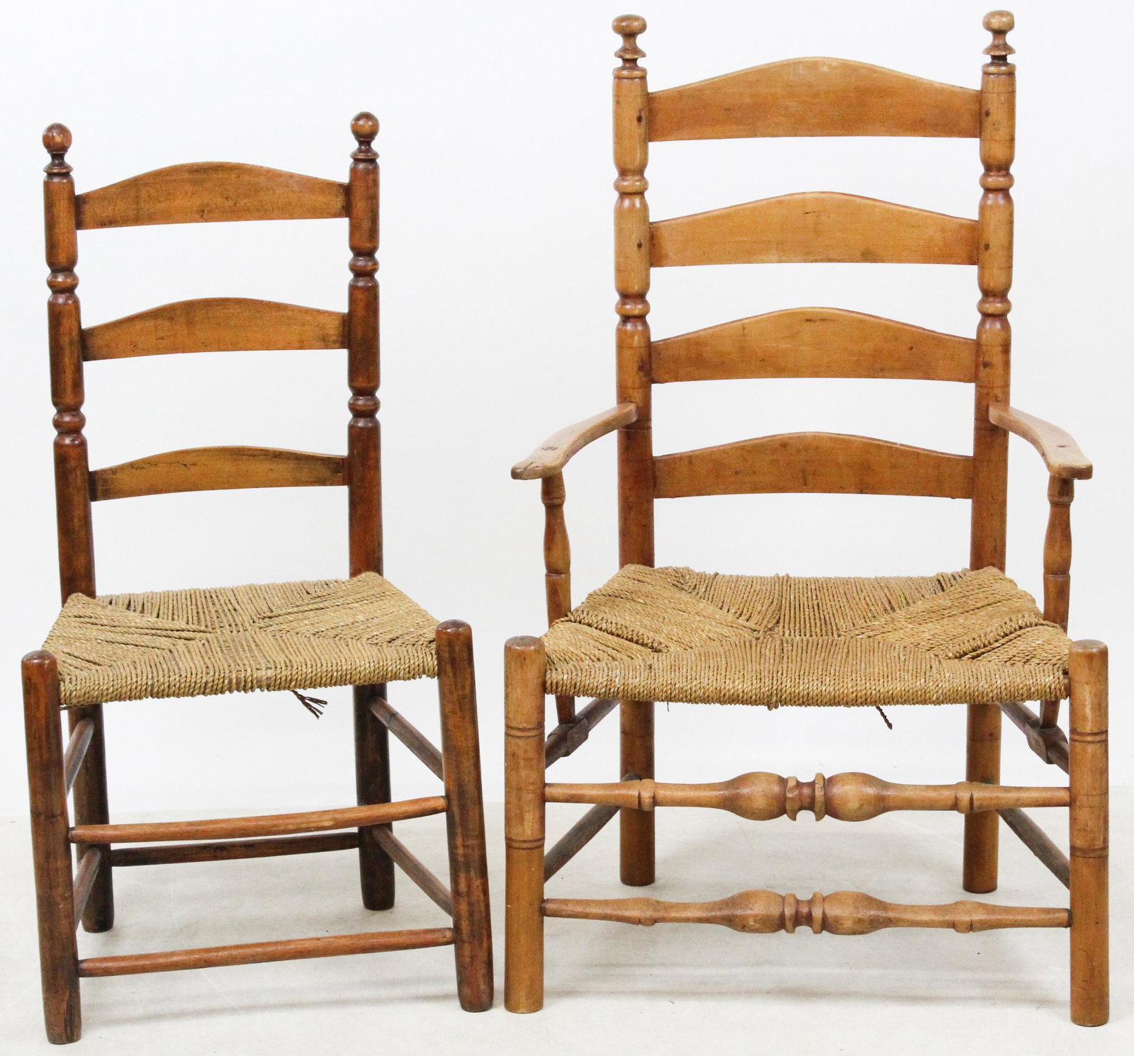 Three Early Windsor, Ladder Back Chairs: 18th c Bowback Windsor side chair, saddle seat, H-stretcher, 7 spindles, seat ht 16 1/2", sold with two Country rush seat ladder back chairs, including an arm chair and a side chair