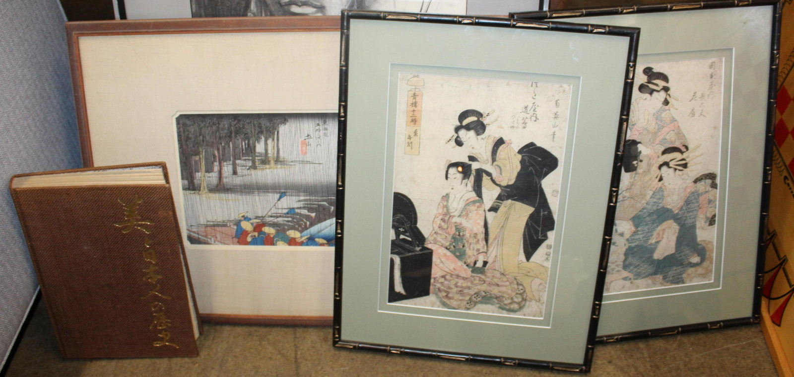 Three Japanese Woodblocks and a Book: Pair of Japanese Edo Period Ukiyo-E woodblock prints of courtesans at rest signed in cartouche /kanji characters each 14 x 9.5", 19th c Japanese View of Peasants in the rain 9.5 x 14" and Bradley Smit