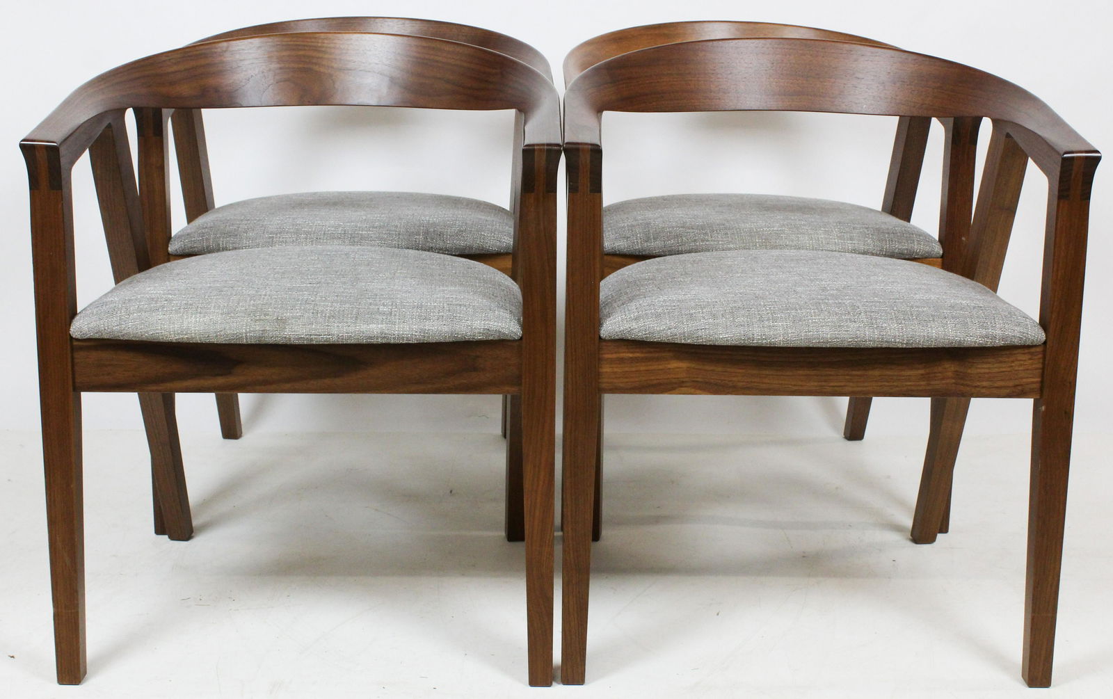 A Set of 4 Thomas Moser Arm Chairs: A set of 4 signed Thos Moser Cabinet Makers Auburn Maine 2019 Paul G Malf?. Black walnut horseshoe design armchairs or Cumberland Chair. Tendon & peg construction, tweed type seat cover. Excellent con
