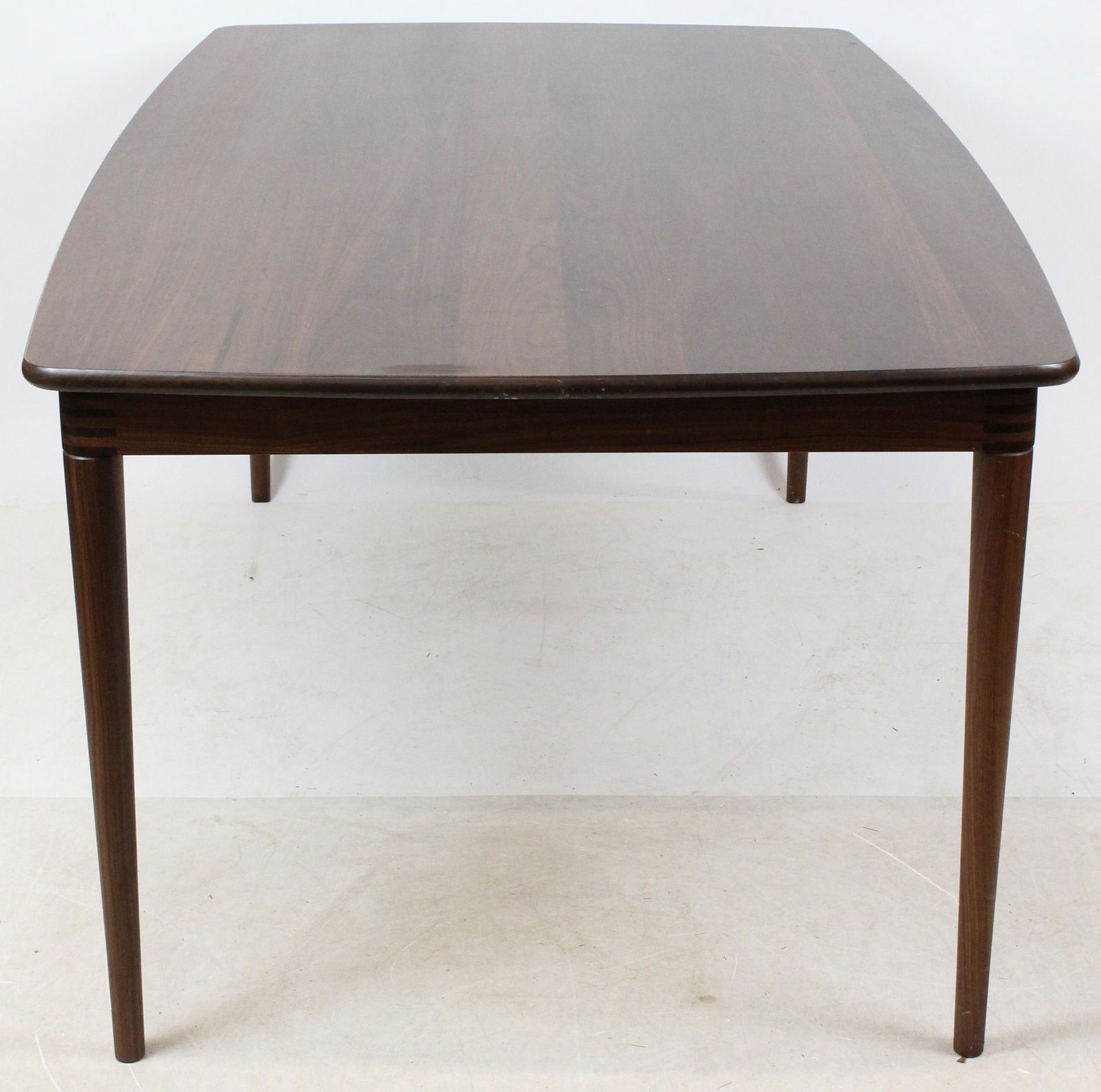 Thomas Moser Dining room Table: A black walnut signed Thos Moser Cabinet Makers Auburn Maine 2019 Matt Harvey dining room table or Boat Top Table. 72" long, 42" wide, 30" high. Fine construction.