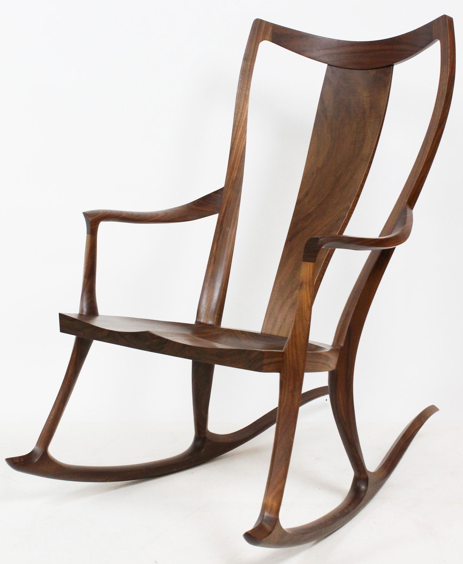 Thomas Moser Rocking Chair: A black walnut signed Thos Moser Cabinet Makers Auburn Maine 2019 Paul G Matif? Rocking chair or Pasadena Rocker. 42" h, 25" w, 40" l.