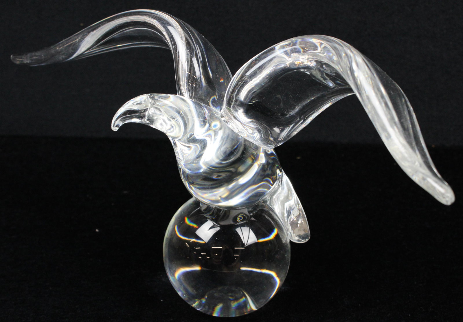 Steuben James Houston Eagle Crystal Figurine: Steuben mid century blown crystal art glass eagle in flight on spherical base figurine, designed by James Houston 1964, roughness to beak 6.75" x 12"