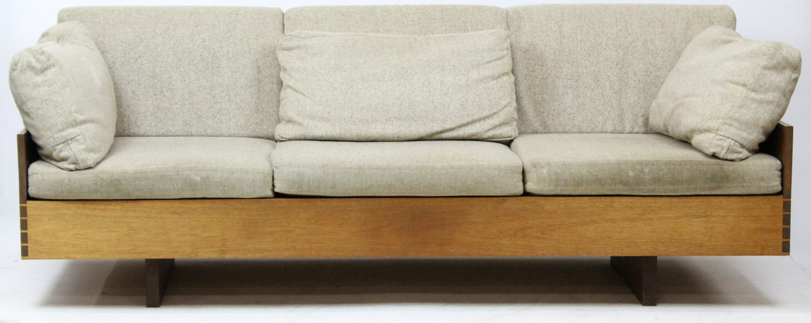 American Studio Walnut Sofa: Mid-Century American studio craft walnut sofa. Dovetailed construction, oak secondary. Attributed to Simon Watts Putney Vermont. 83" long, 36" deep, 14" high to seat. Cream tweed covered triple cushio