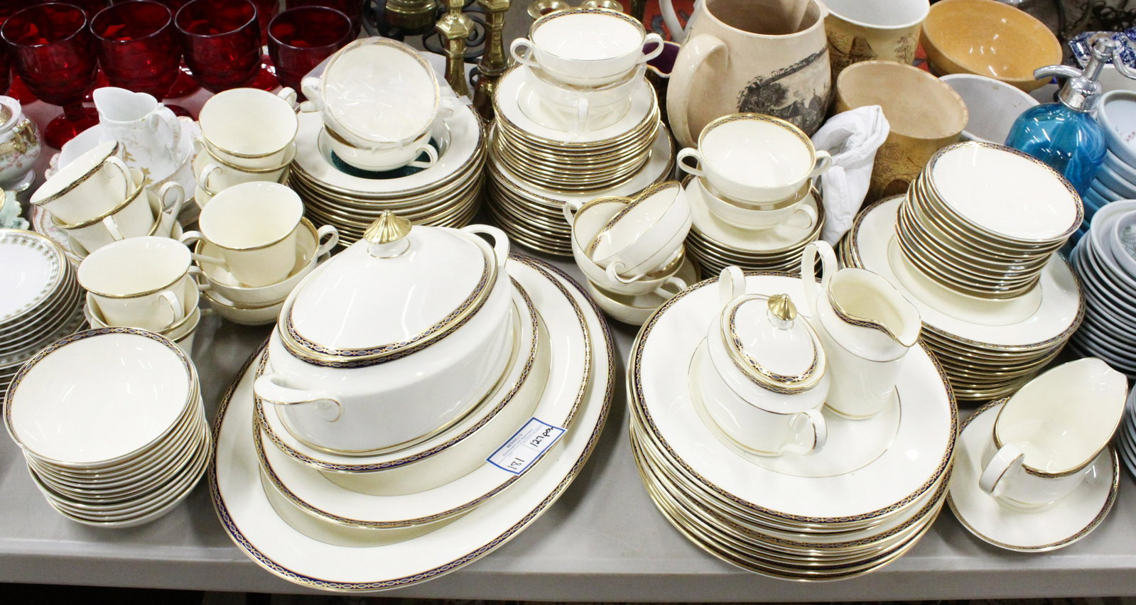 127 pcs. Minton St. James Porcelain Dinnerware: 127 pcs. Minton "St. James" pattern English bone china porcelain dinnerware including 23 platters, covered serving dish, sauce boat and undertray, sugar bowl and creamer, soup bowls, double handled bo