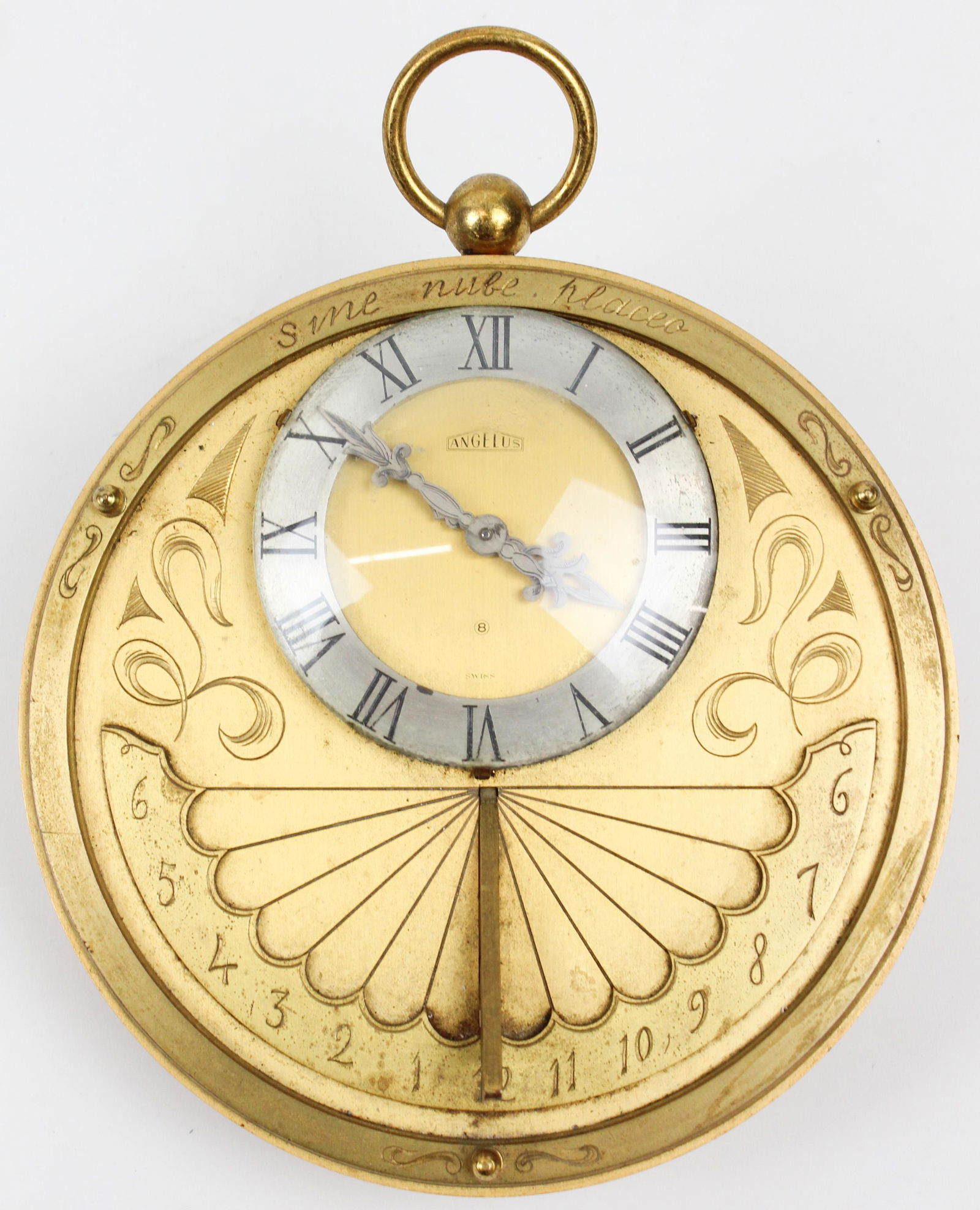 Angelus Brass Sundial Clock: Angelus brass "Sundial" clock, 8 day Swiss movement, diameter 6"
