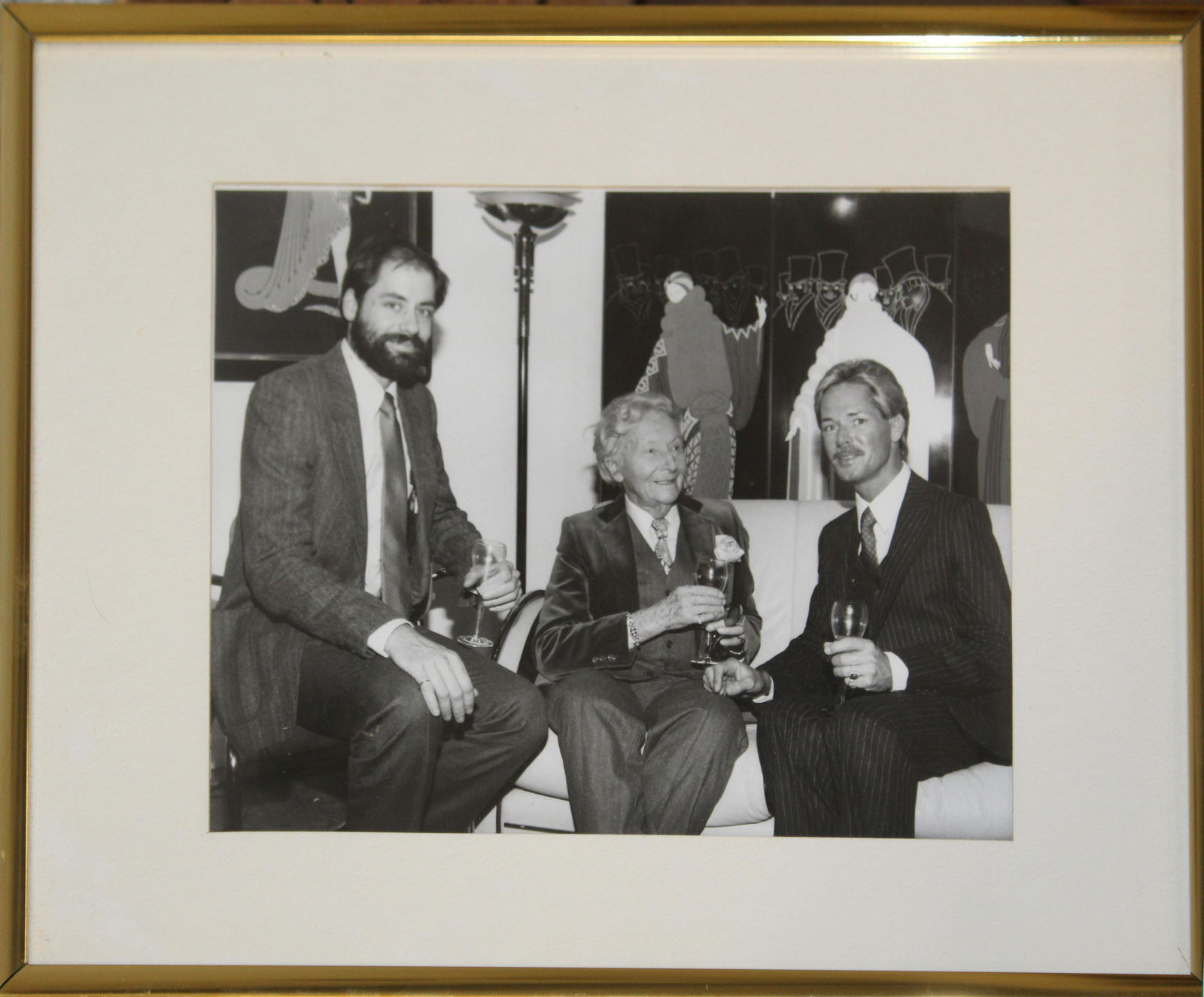 Erte- Romain De Tirtoff (RU/FR 1892-1990): Erte- Romain De Tirtoff (Russian/ French 1892-1990) framed gelatin photo of Erte with associates circa 1975, 9 framed circa 1970 costume prints by Erte, signed in plate offset litho process. Each appr