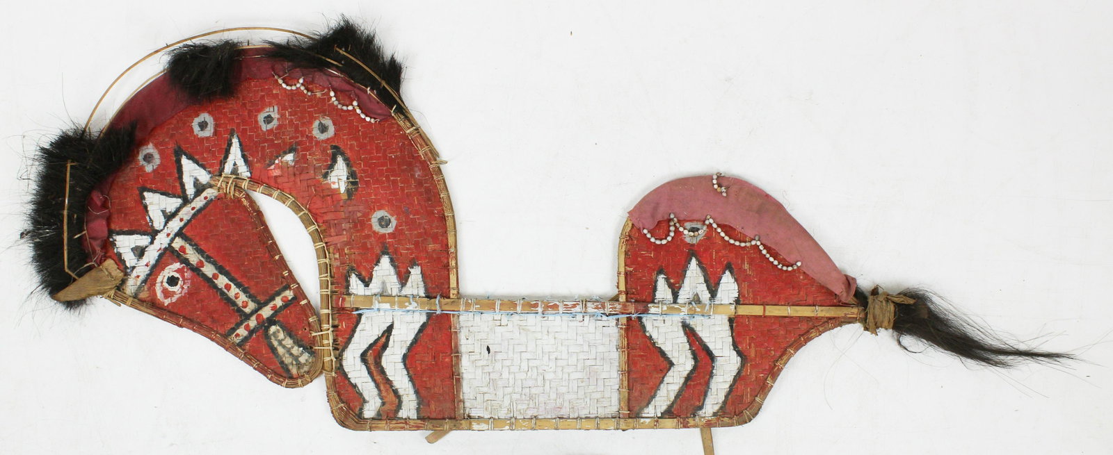 Mid 20th c Ethnographic Wall Sculpture: Mid 20th c Ethnographic wall sculpture of a horse, basketwork, beads fur, cloth, bamboo, polychrome paint (one structural frame piece broken), length 60"