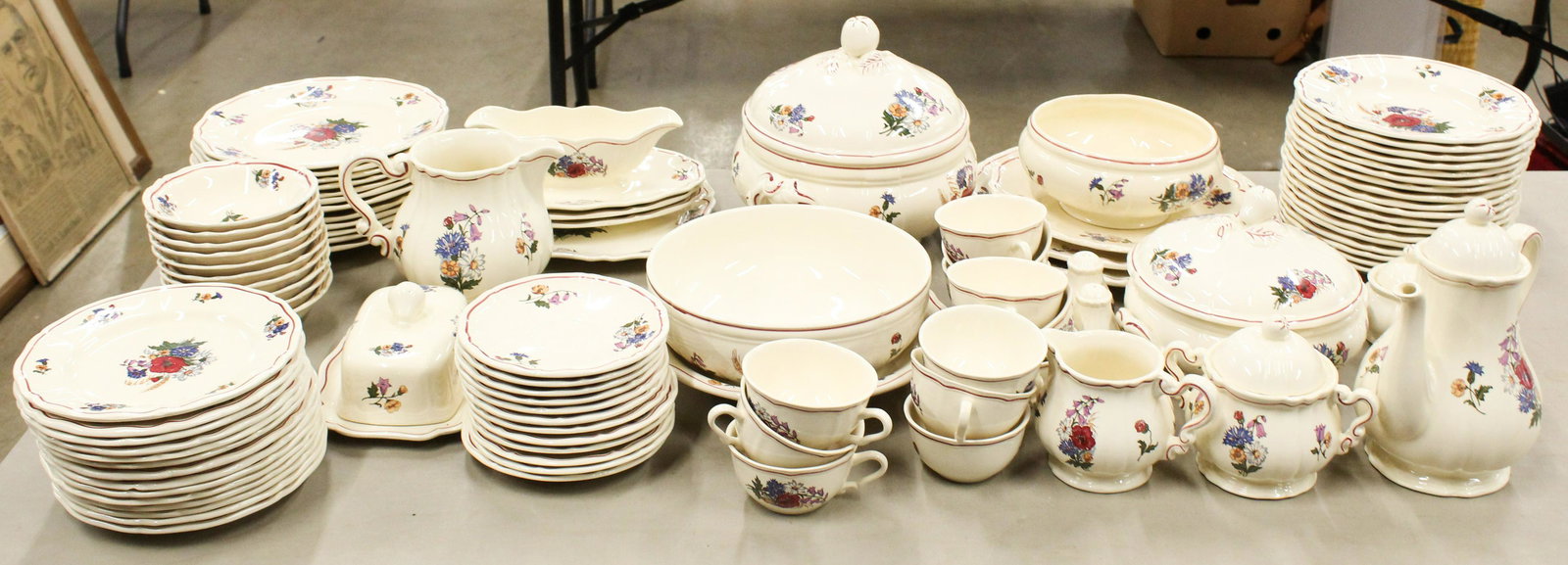 98 pcs. Sarreguemines Argeste Dinnerware: 98 pcs. Sarreguemines "Argeste" pattern porcelain floral poppy decorated dinnerware including tea set, butter dish, milk pitcher, tureen, covered serving dish. sauceboat, round serving bowl, salt and 