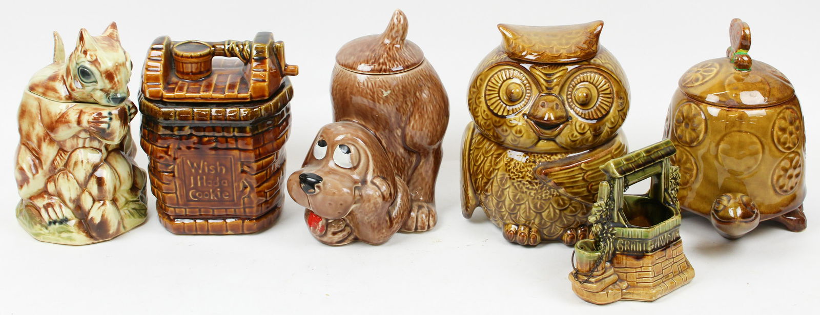 Collection of 1970's McCoy Pottery Cookie Jars: Collection of 5 1970's McCoy Ohio art pottery cookie jars including squirrel, owl, turtle, dog, and wishing well, accompanied by a wishing well planter ht. 6.5"-11"