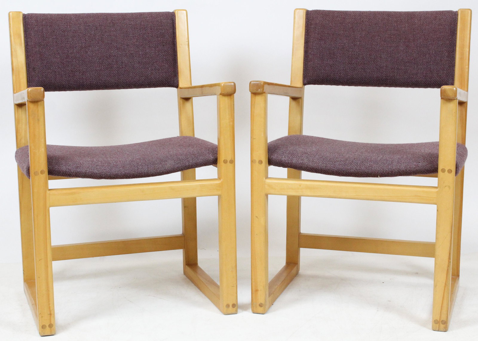 Pair of Pompanoosuc Mills Arm Chairs: A pair of flame birch Pompanoosuc Mills Arm Chairs. Peg construction, mauve woven fabric covering. 21" w, 18" d, 33" h.