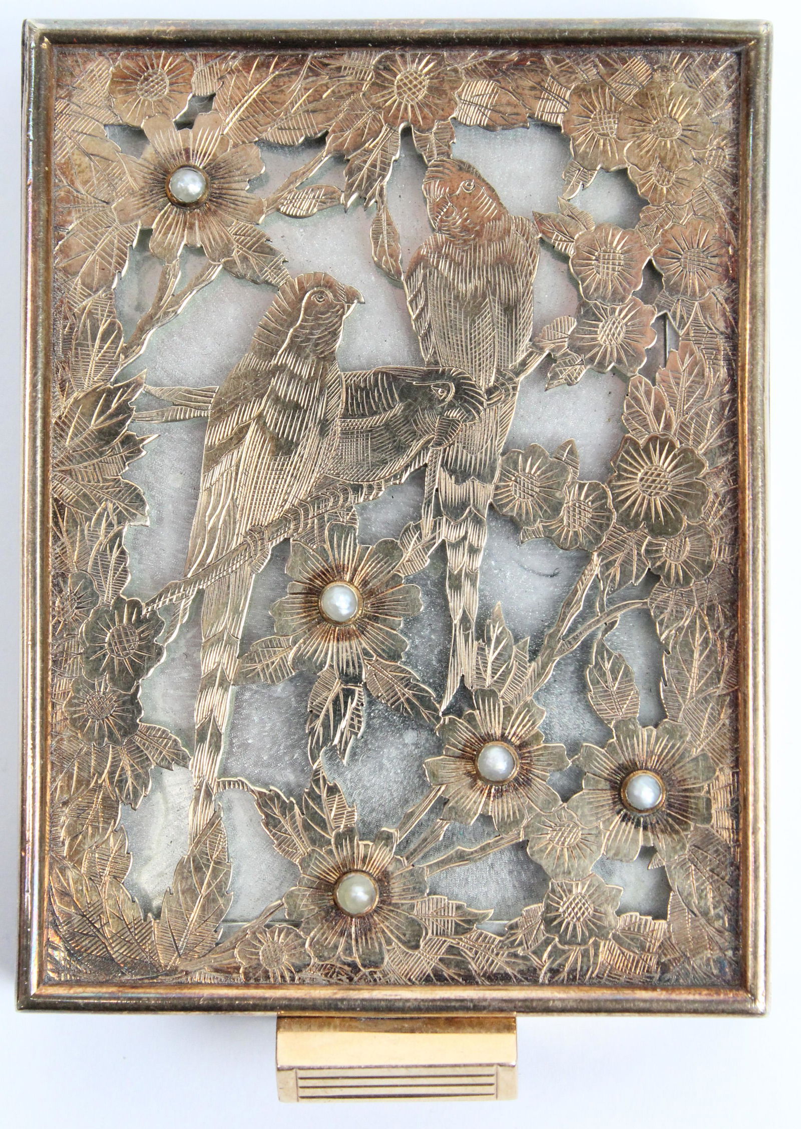 Boucheron Paris Compact: A Boucheron Paris sterling, gold, and pearl compact. Gold engraved open work top panel with birds, flowers, and pearls. Gold clasp, sterling frame and interior. 2 1/4" x 3" x 1/2".