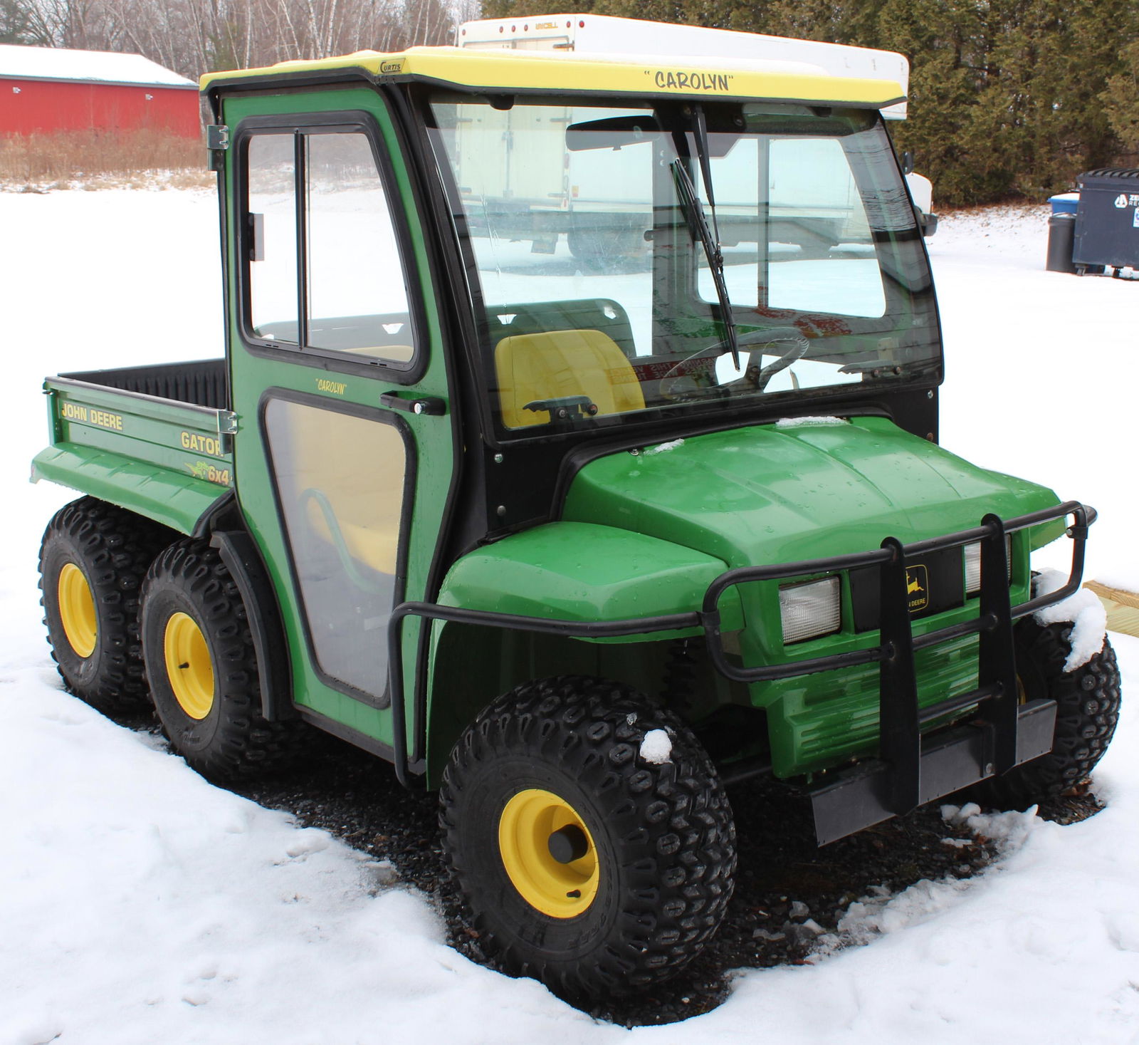 John Deere Gator 6 x 4: John Deere Gator 6 x 4, 517.7 hours, automatic transmission, hard side cab, tilt bed, heater, trailer hitch, front grille, headlights, runs good, serial number W006x4x050938. Diesel engine.