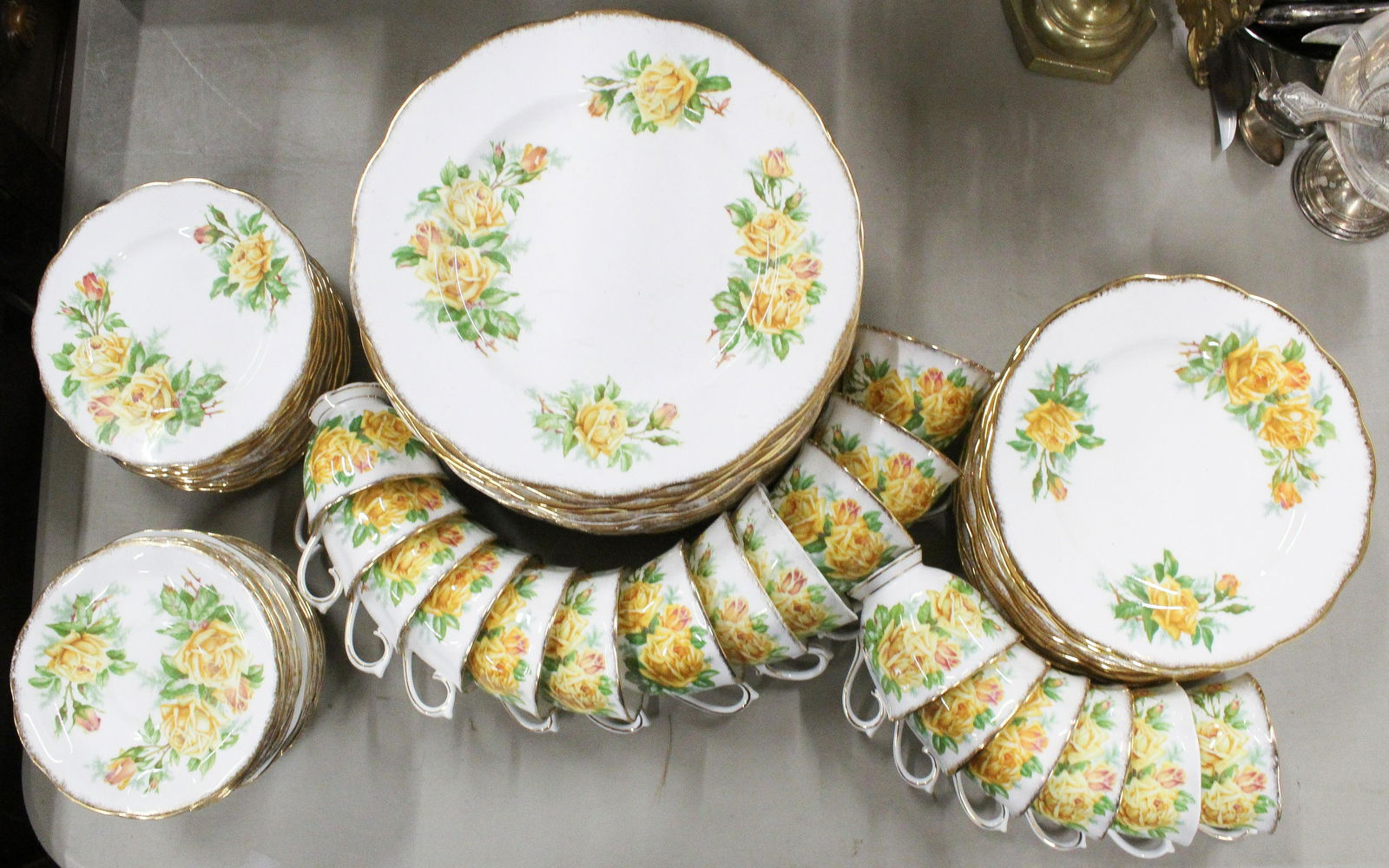 59 pcs. Royal Albert Tea Rose Dinnerware: 59 pcs. Royal Albert English bone china "Tea Rose" pattern porcelain dinnerware including many dinner plates, side plates, luncheon plates, and tea cups and saucers