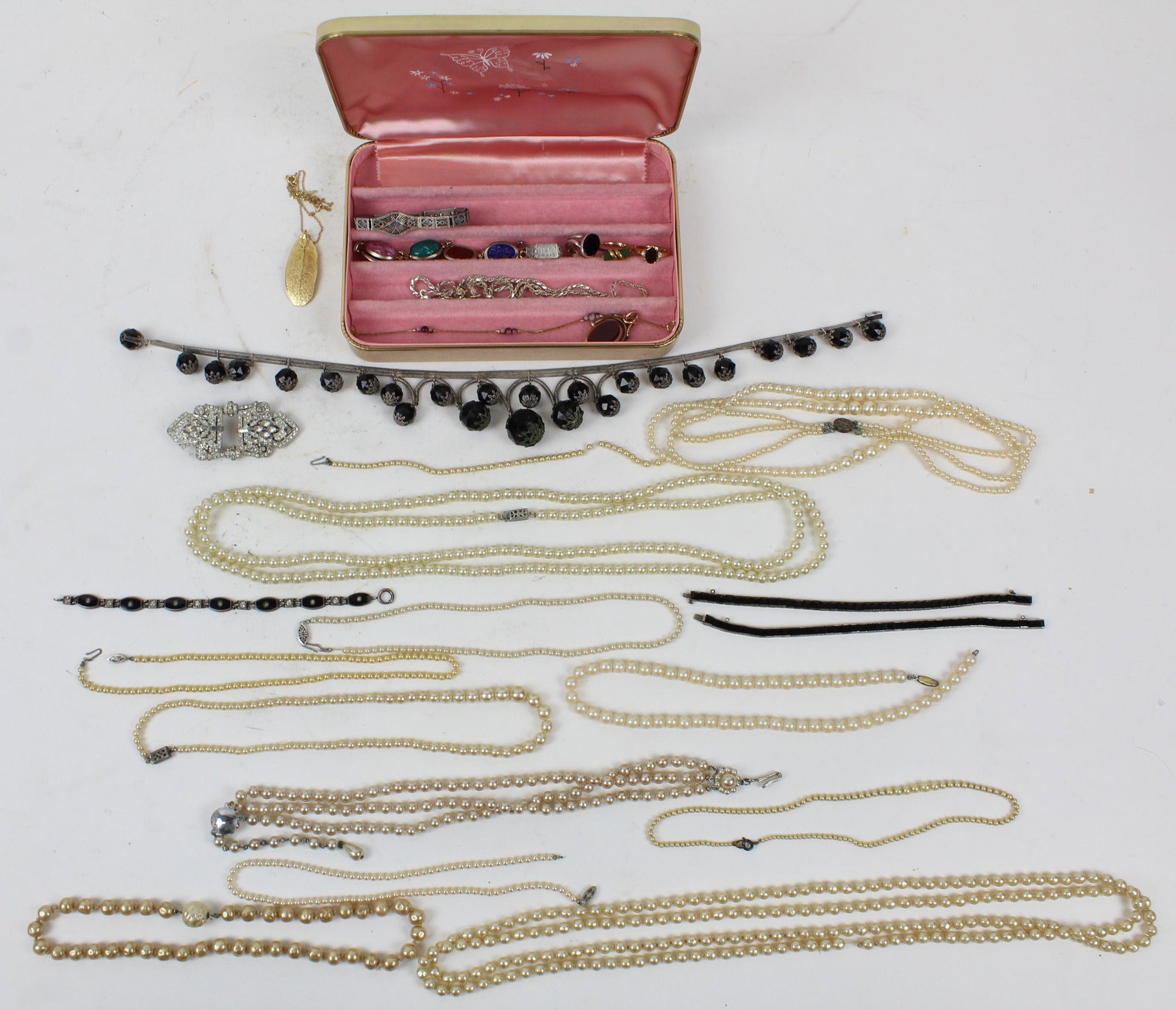 A Group of Costume & Sterling Jewelry: A good group of vintage jewelry including a fine sterling & onyx multi ball necklace, sterling & onyx bracelets, sterling openwork bracelet, rhinestones, faux pearls, a small real pearl necklace, and 