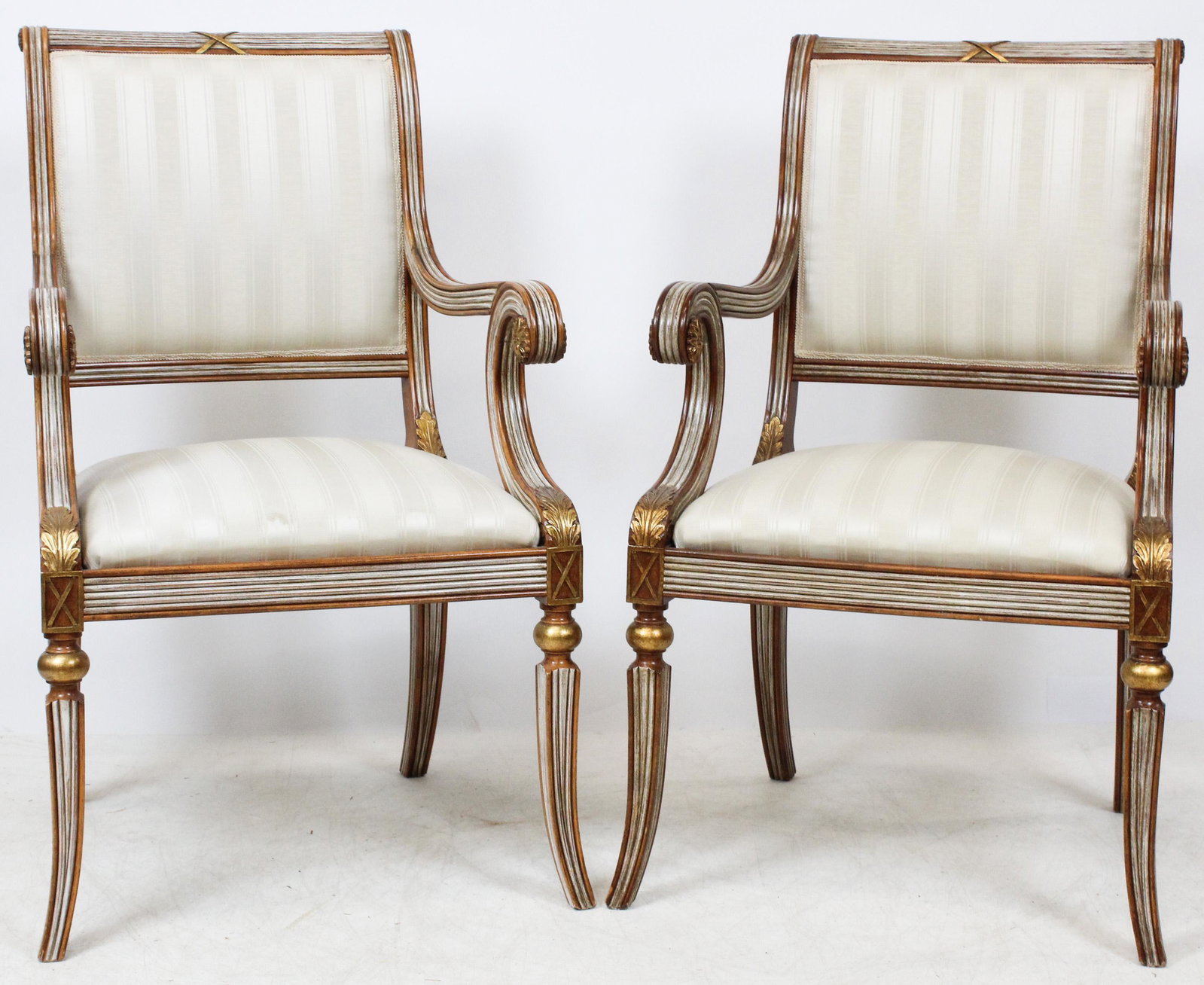 Pair of Classical Revival Italian Arm Chairs: Pair of Neo-Classical arm chairs with a faux silver & gilt surface. Made in Italy Galimberti Lino. Cream silk fabric. 39" h , 23" h.
