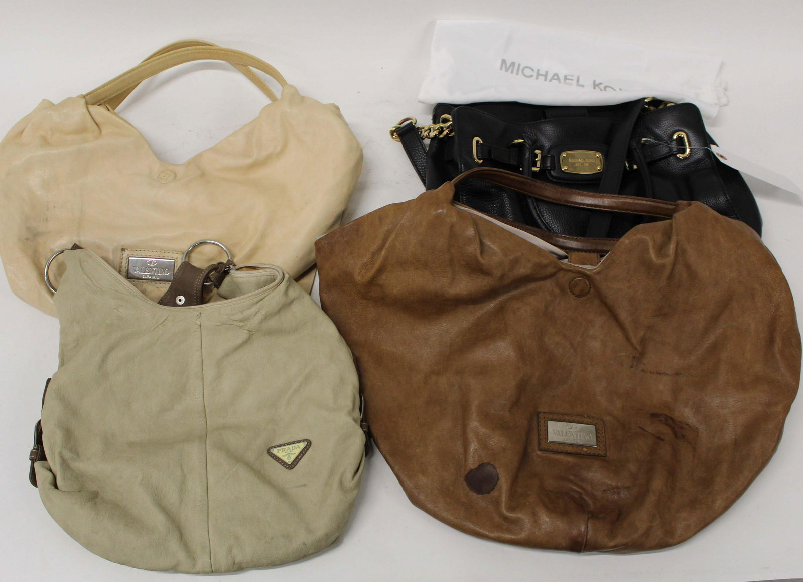 Four Prada, Valentino, Michael Kors Handbags: Four designer handbags- Prada, two Valentino, Michael Kors, show signs of wear, use, widths 13", 14" 22"