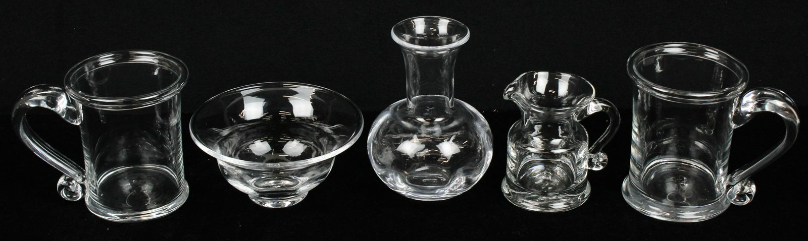 5 pcs. Simon Pearce VT Blown Glass Tableware: Group of 5 pcs. Signed Simon Pearce Quechee, VT artisan hand blown crystal tableware including pair of "Windsor" tankard mugs, small "Shelburne" bowl, "Windsor" creamer, and small vase ht. 2.75"-6.25"
