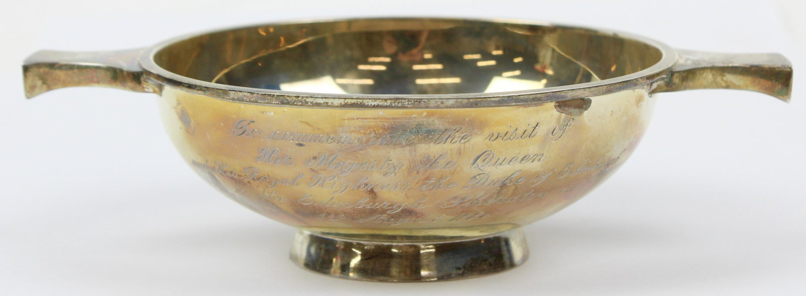 Scottish Sterling Silver Handled Quaich Bowl: Hamilton & Inches LTD Edinburgh Scottish sterling silver double handled quaich bowl with delicate cursive script hand engraved inscription "To commemorate the visit of Her Majesty the Queenand His Roy