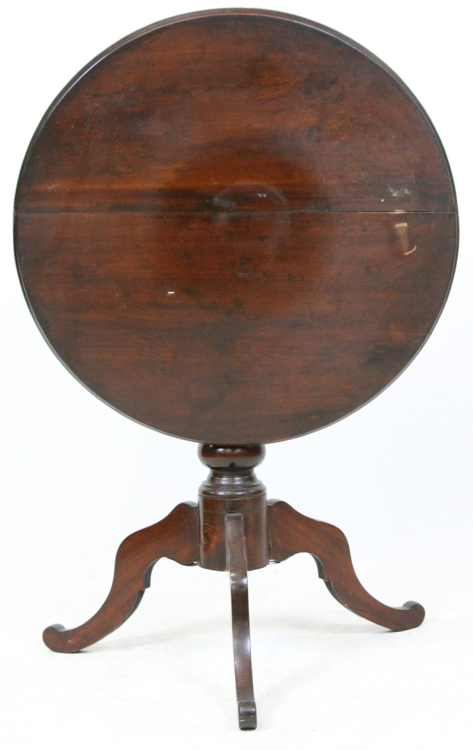 Victorian Transitional Tilt Top Tea Table: Victorian Transitional Tilt top tea table, with cut out legs, age check in top, walnut- top 27" diameter 27" high,