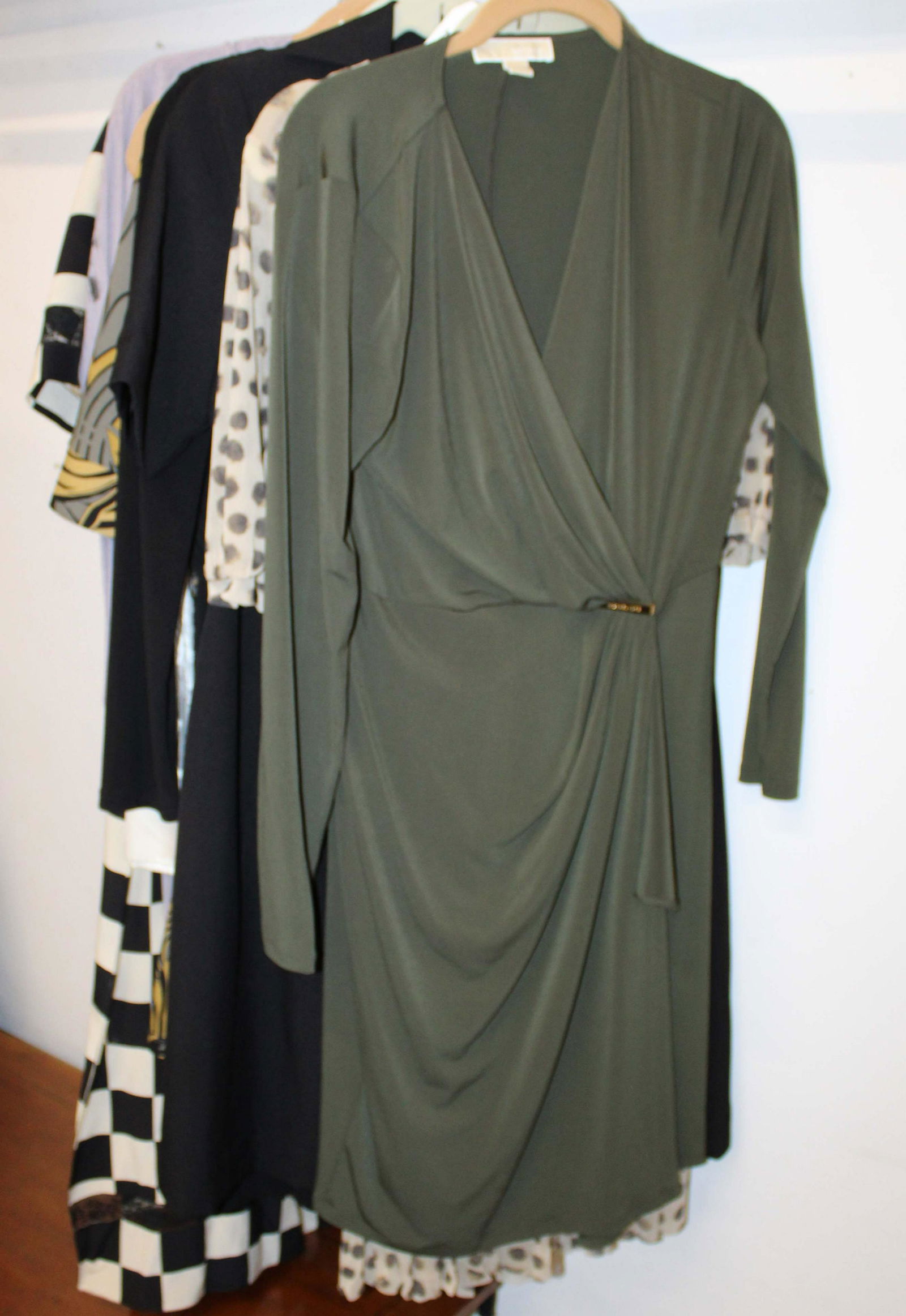 Nine Designer Label Fashion Dresses: Nine designer fashion dresses, Adrianna Popell black dress (size 6), Michael Kors white lace strapless 9 size M), Ellen Tracy black short sleeve dress (size 10), Michael Kors olive dress (size 10), Ma