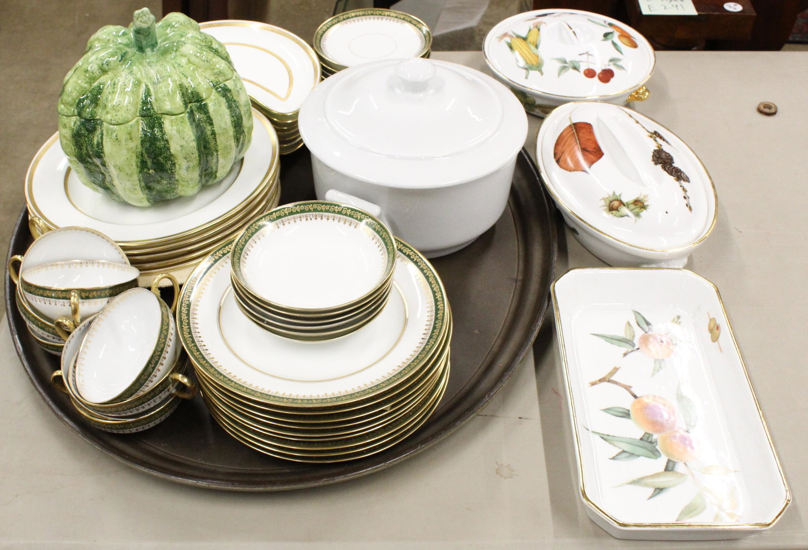 Group of Fine China Incl. Minton, Limoges, etc.: Group of fine porcelain tableware including 3 Royal Worcester Evesham oven proof dishes, 6 Minton for Tiffany & Co dinner plates with gilt enamel crest, crescent shape dishes, luncheon set of green ba